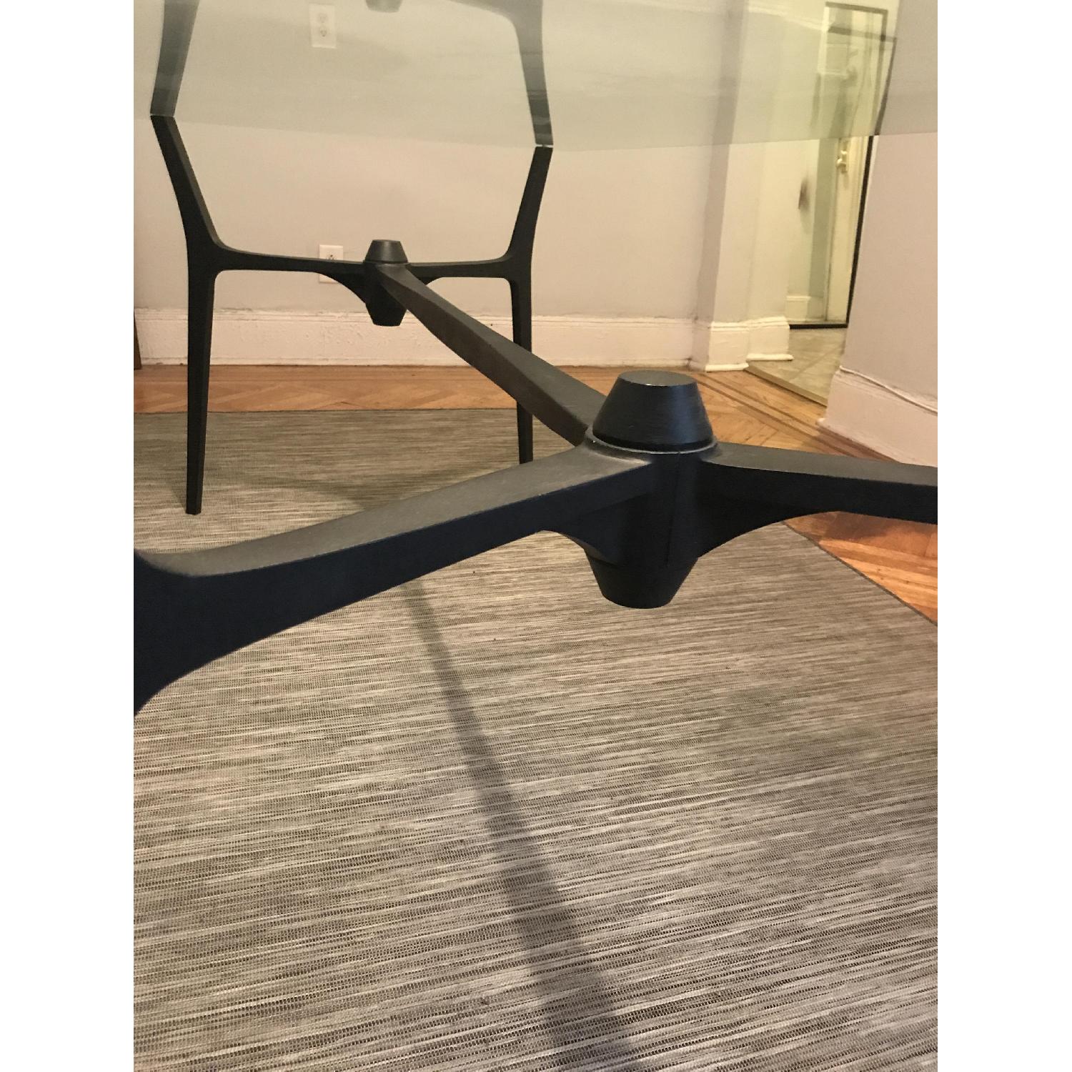 CB2 Glass Dining Table w/ Black Metal Base - image-3
