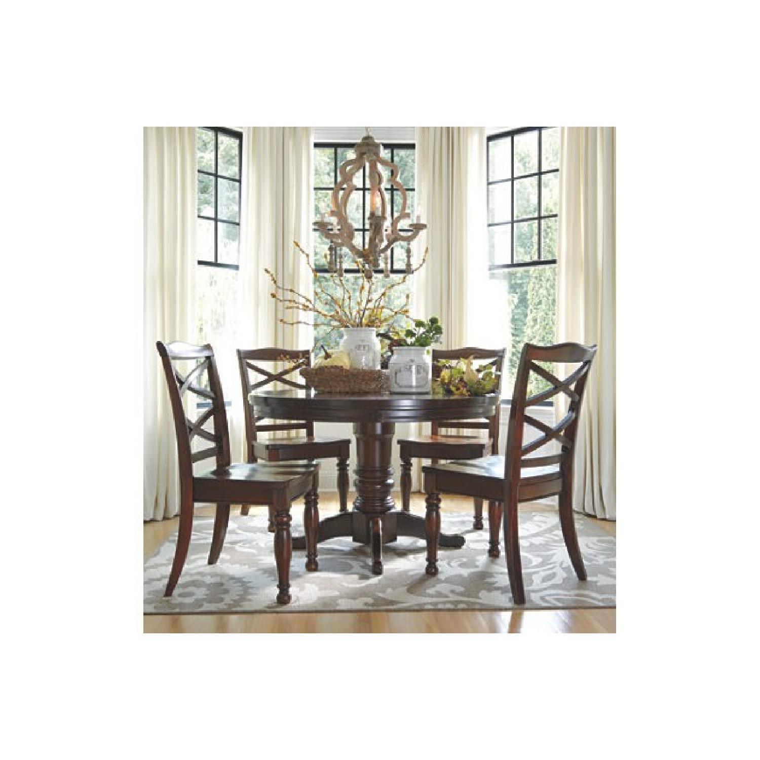 Ashley Round Expandable Dining Table w/ 4 Chairs - image-1