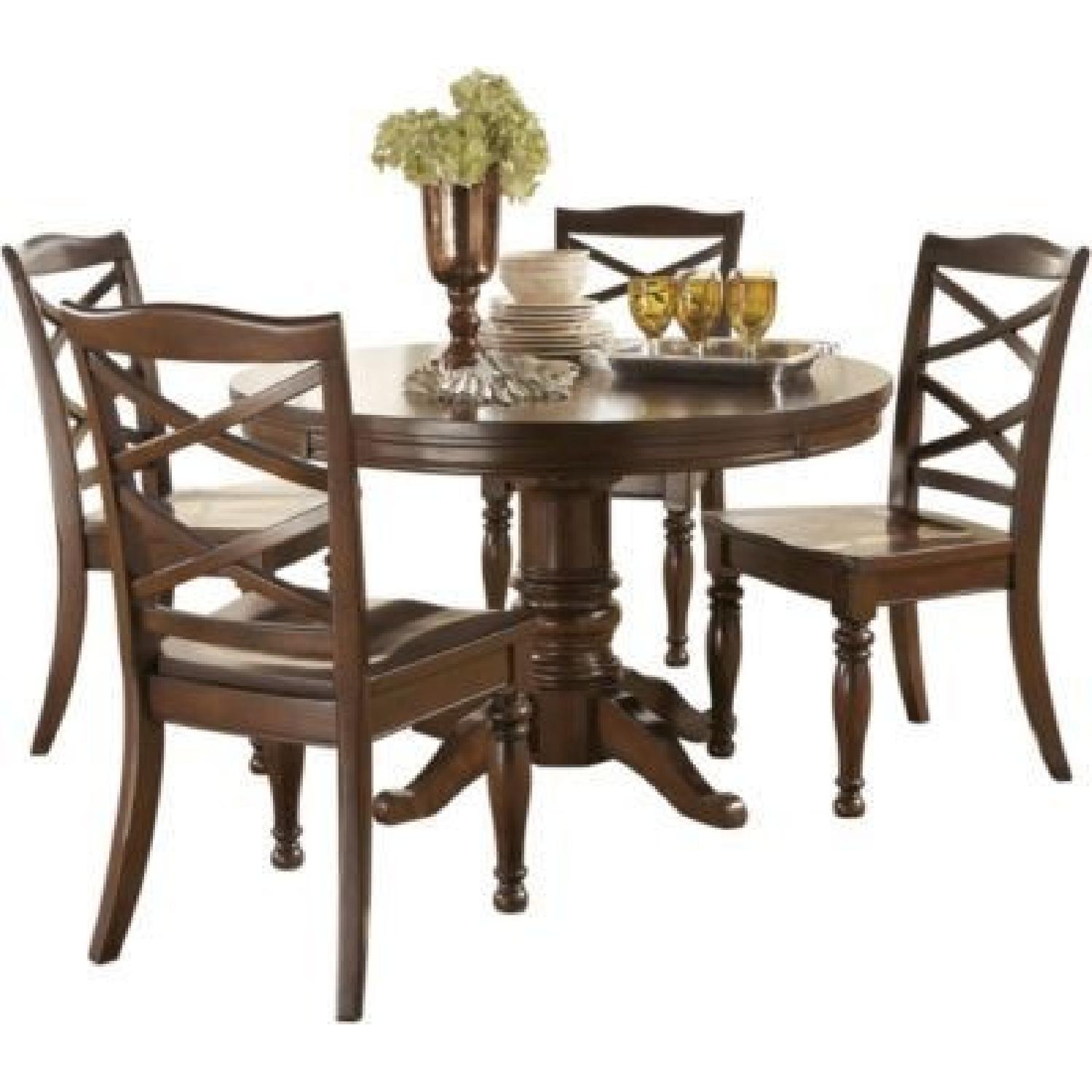 Ashley Round Expandable Dining Table w/ 4 Chairs - image-0