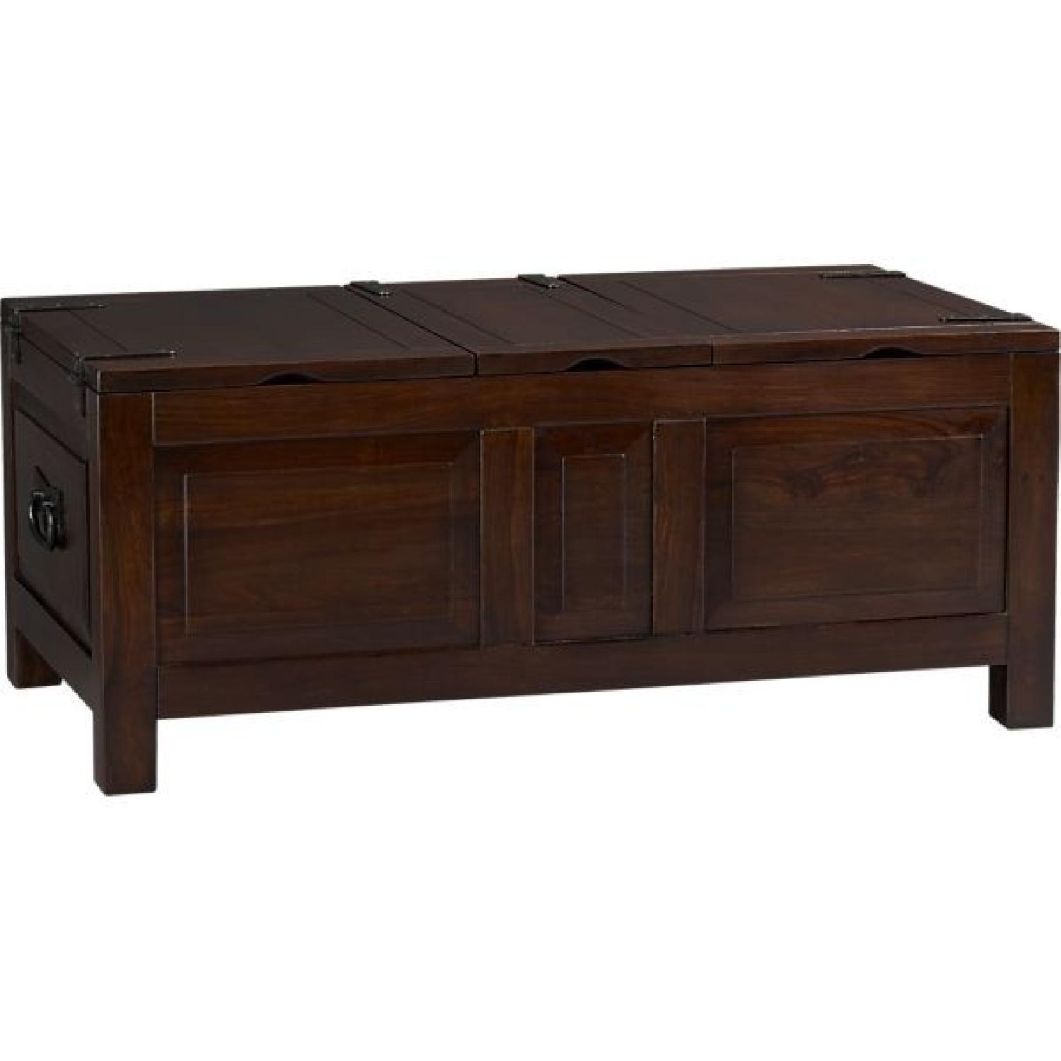 Image showcasing Crate & Barrel Tucker Trunk Storage Coffee Table - AptDeco