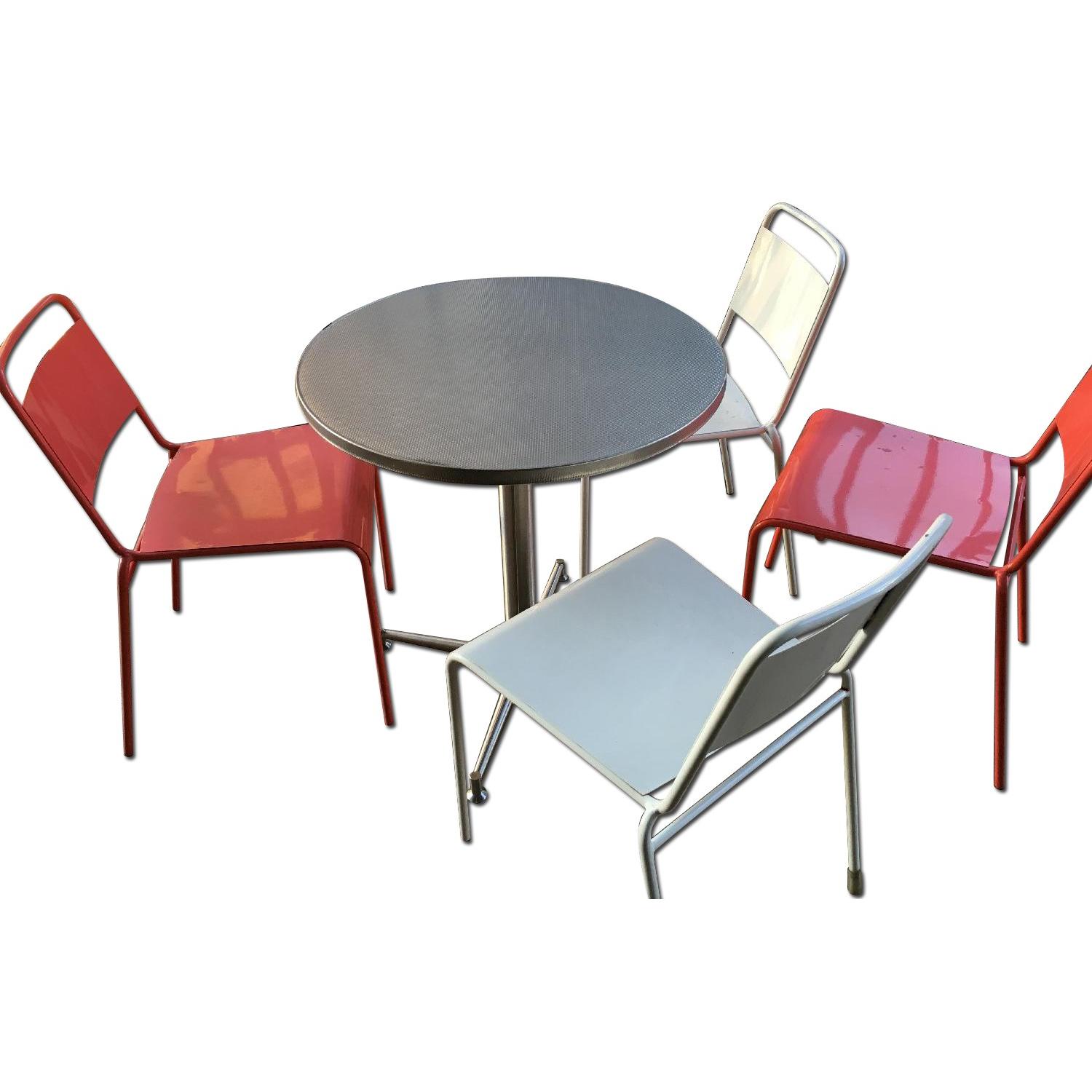 CB2 Chrome Patio Table w/ 2 White & 2 Orange Chairs AptDeco