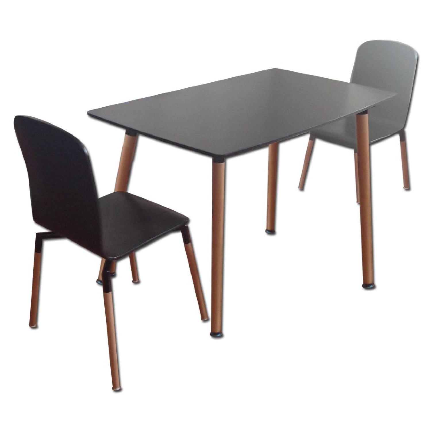 Black Oval Dining Table w/ 2 Black Chairs - AptDeco