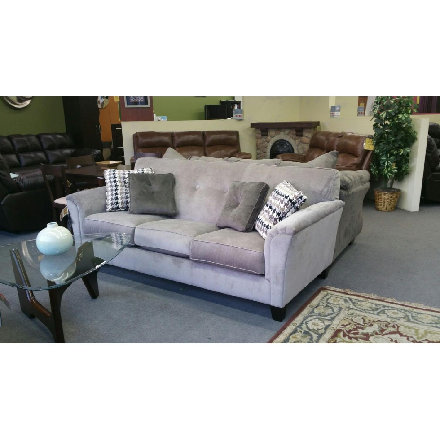 Ashley's Grey Sofa + Loveseat - image-1