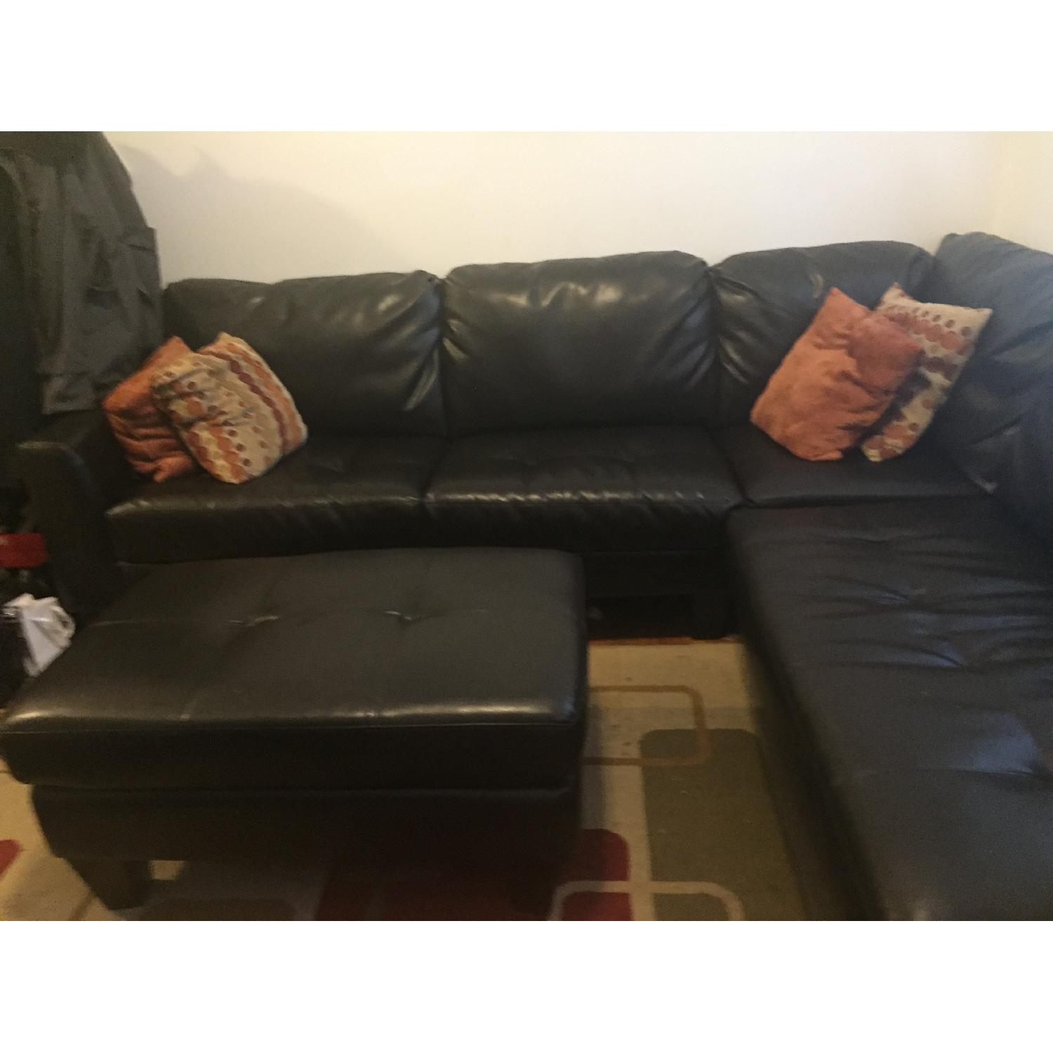 Jennifer Convertibles Leather Sectional Sofa & Ottoman AptDeco