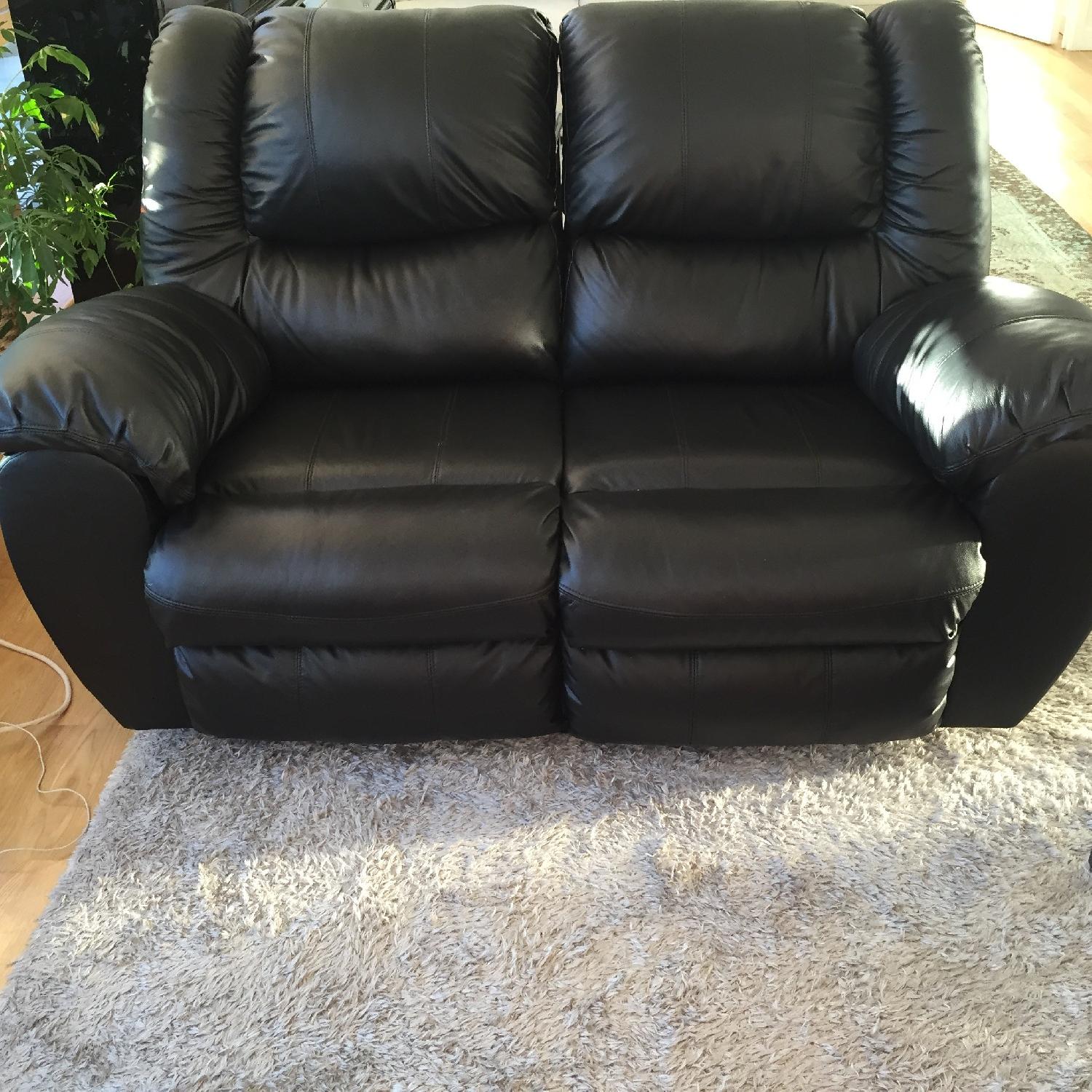 Ashley's Black Leather Recliner Loveseat - image-1