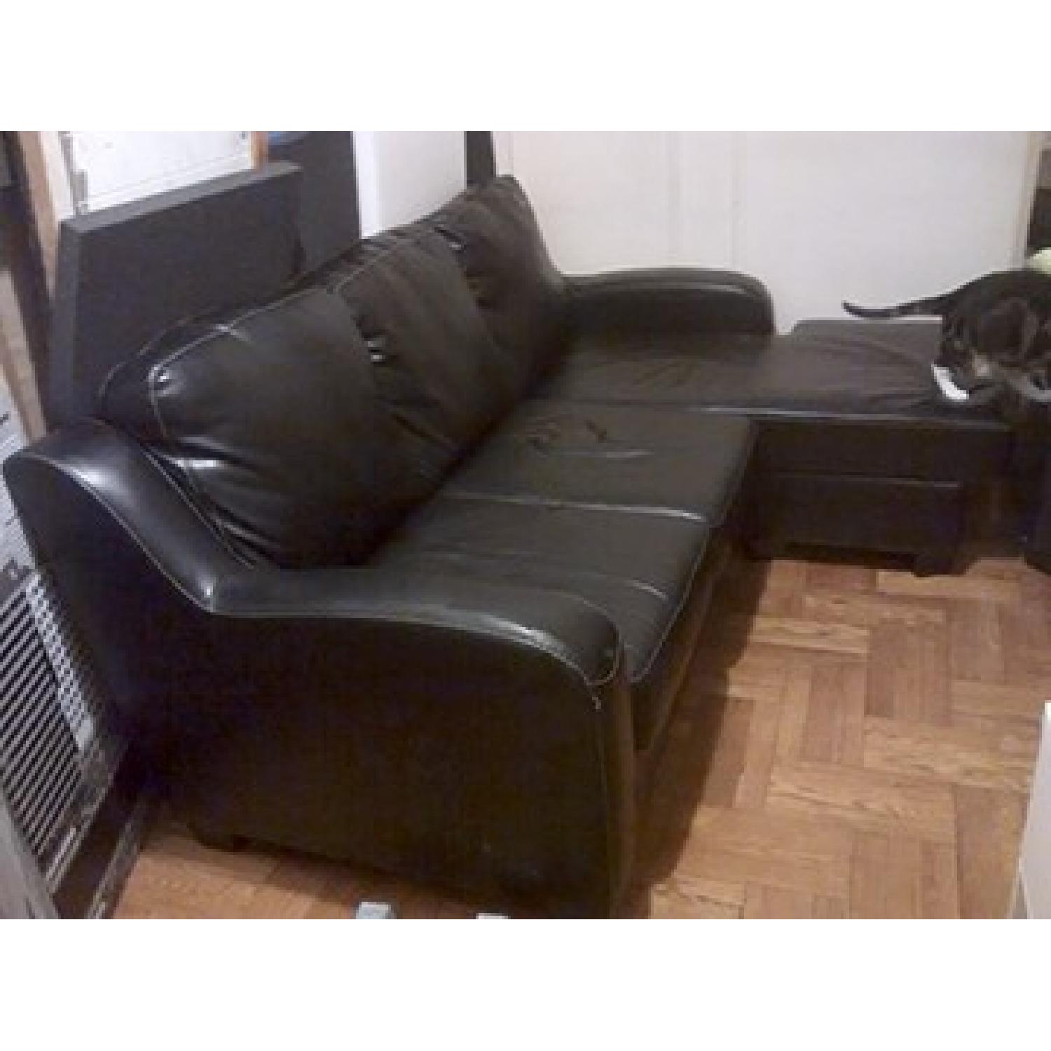 Ashley's Signature Design Devin Durablend Sectional Sofa - image-1