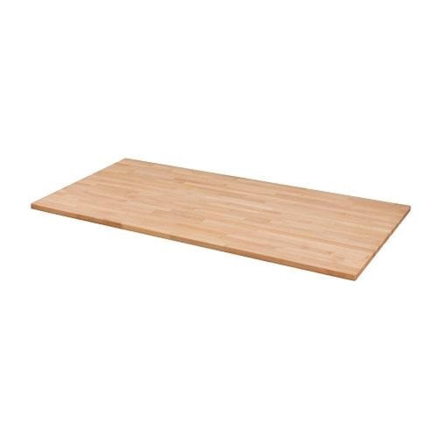 Ikea Natural Wood Table w/ Adjustable-Height Legs - image-1