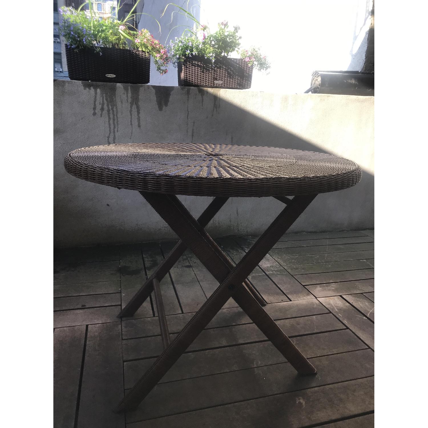 Crate & Barrel Outdoor Wicker Round Table - image-1