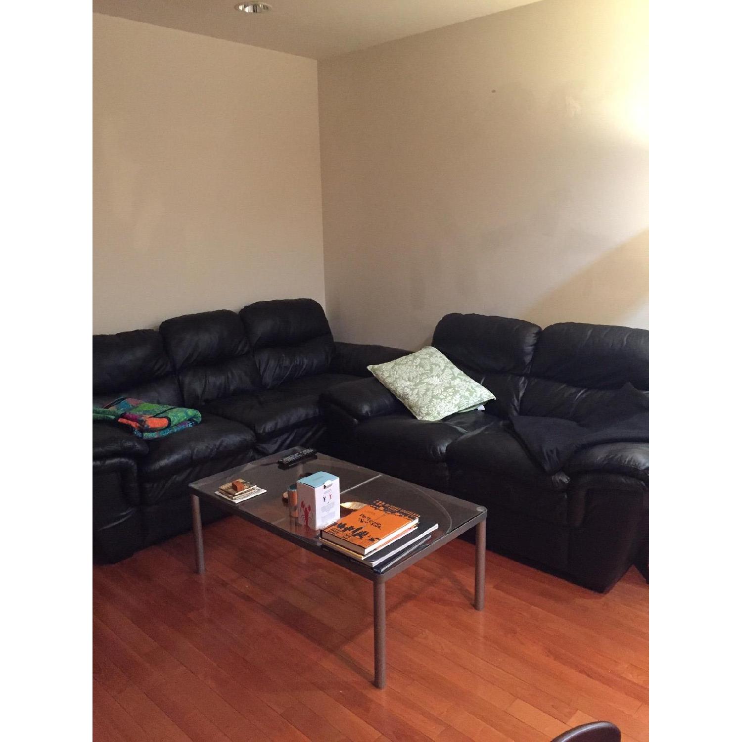 Ashley's Black Leather Sofa + Loveseat - image-1