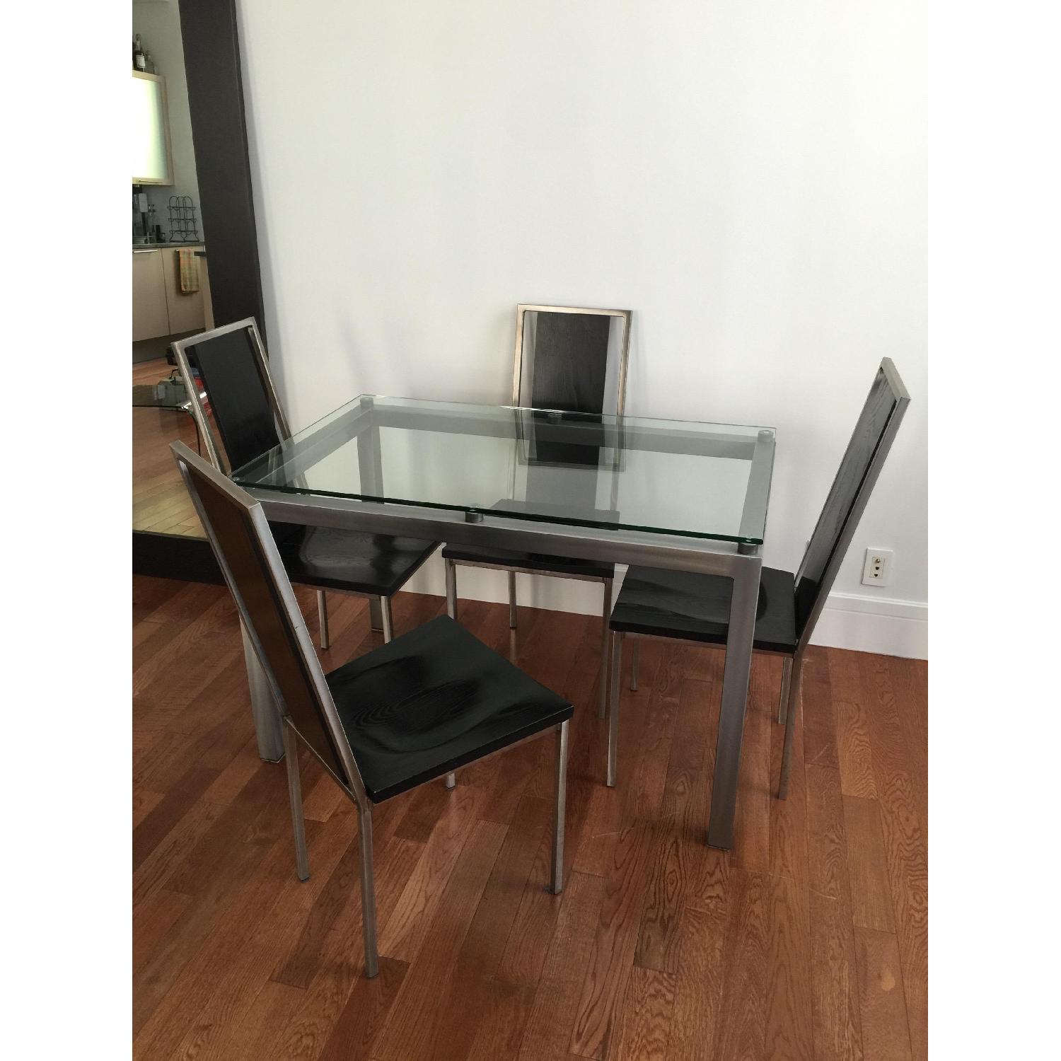 Glass Top/Stainless Base Parsons Table w/ 4 Black Ash Wood Chairs - image-1