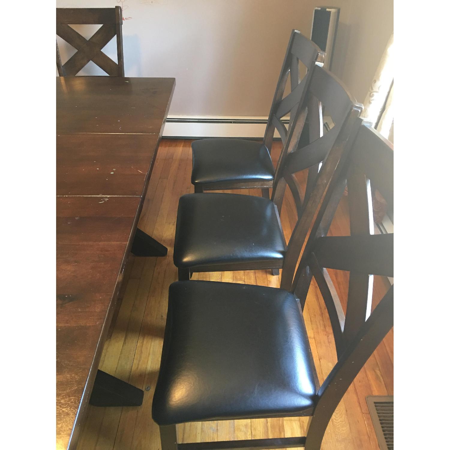 Bob's Wooden Dining Table w/ 8 Cushioned Chairs AptDeco