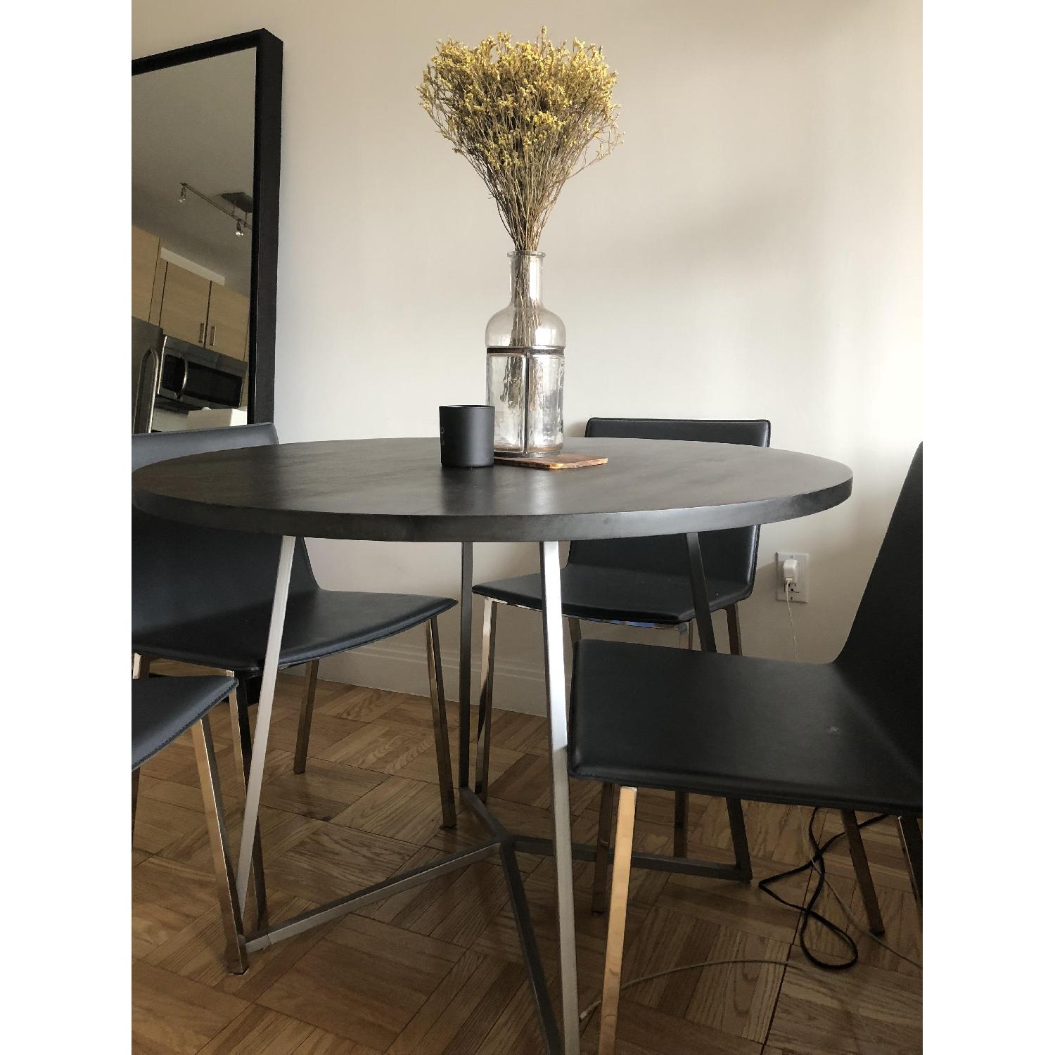 CB2 Peak Round Dining Table w/ 4 Phoenix Carbon Chairs - AptDeco