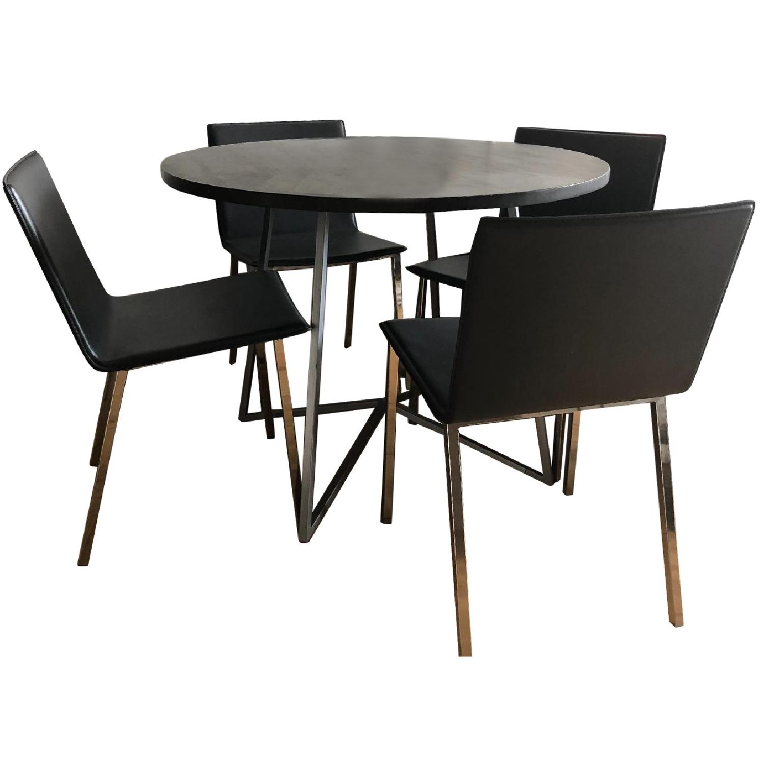 CB2 Peak Round Dining Table w/ 4 Phoenix Carbon Chairs - AptDeco