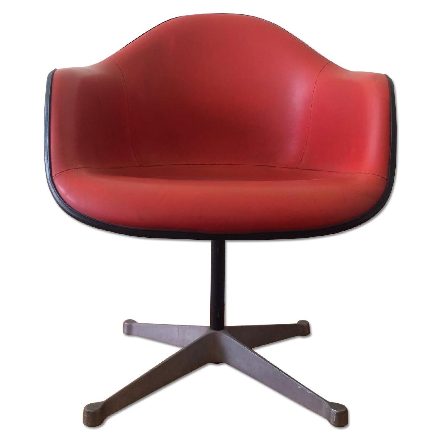 Eames for Herman Miller Orange Swivel Fiberglass Chair AptDeco