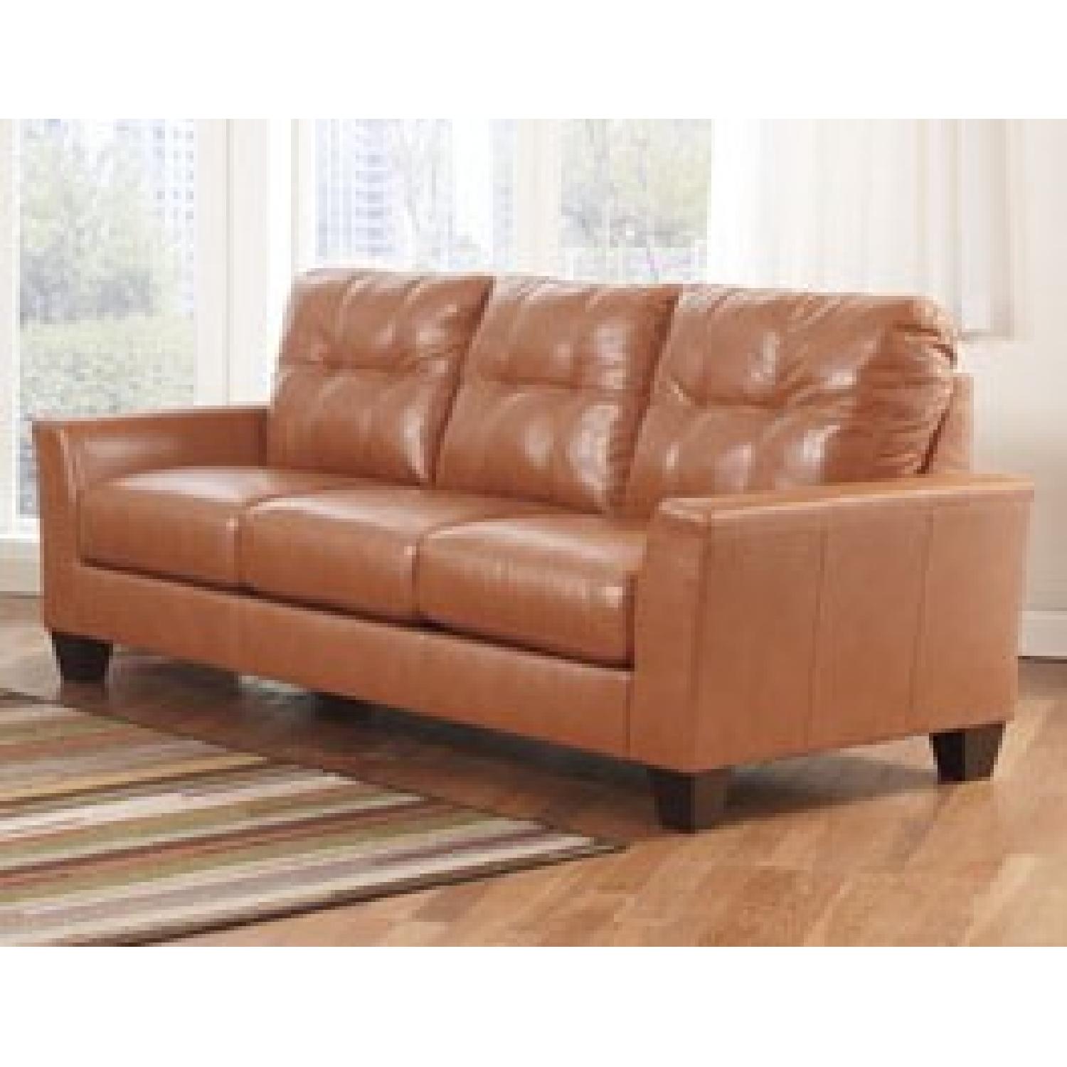 Ashley's Paulie Orange Sofa - image-1