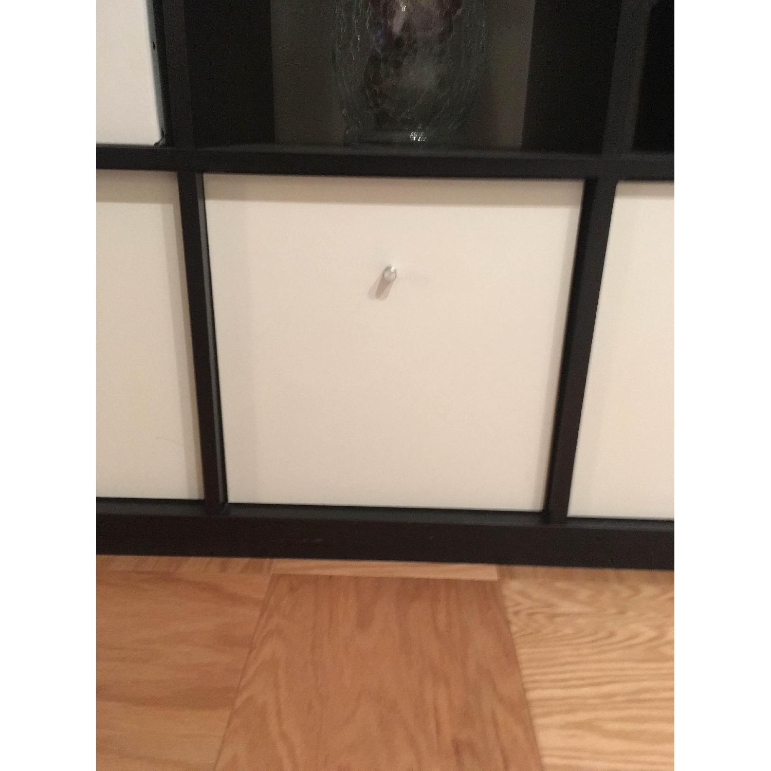 Ikea Black Bookcase w/ 4 Drawers AptDeco