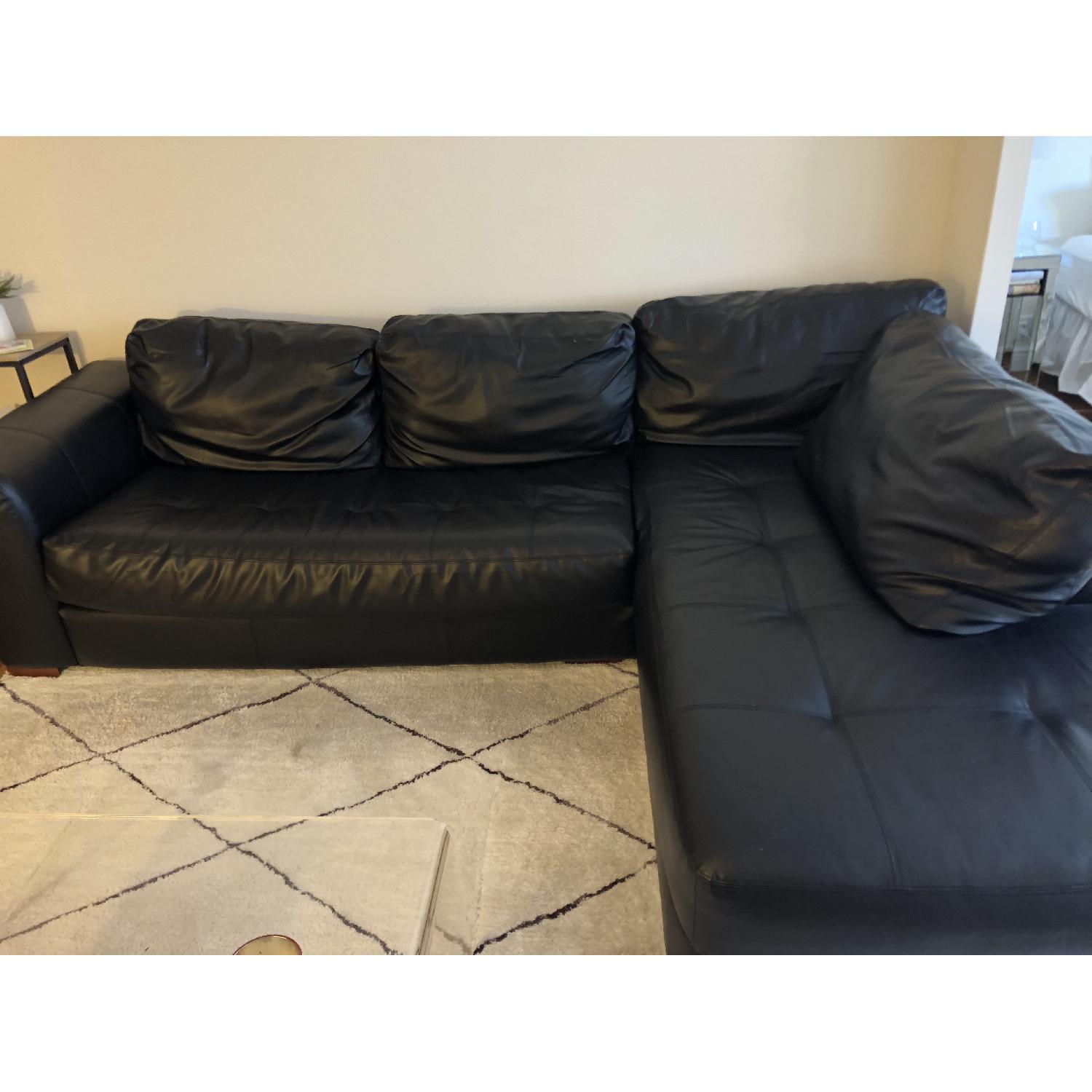 Jennifer Convertibles Black Leather 2-Piece Sectional Sofa - image-1