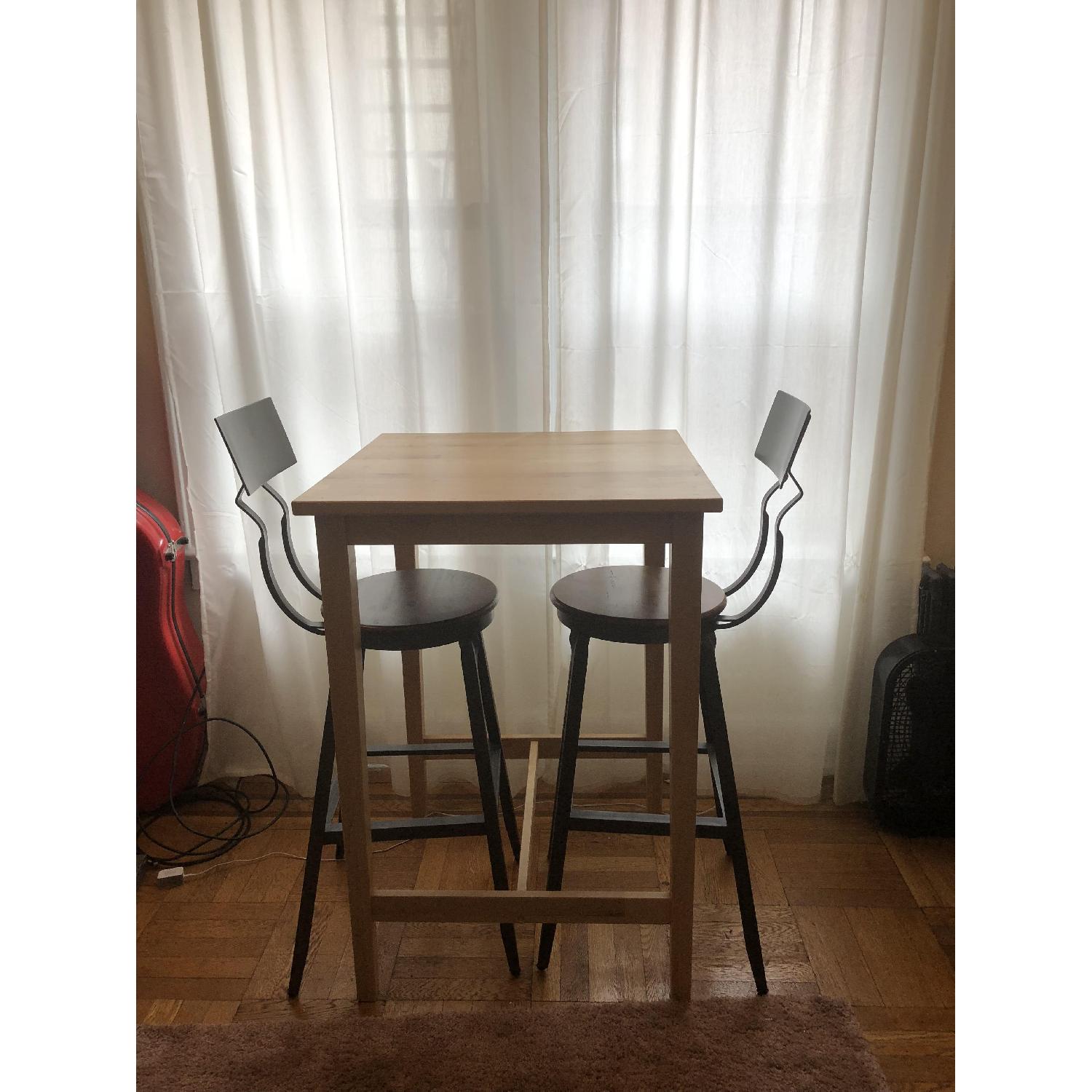 Ikea Birch Table w/ 2 World Market Bar Stools - image-1