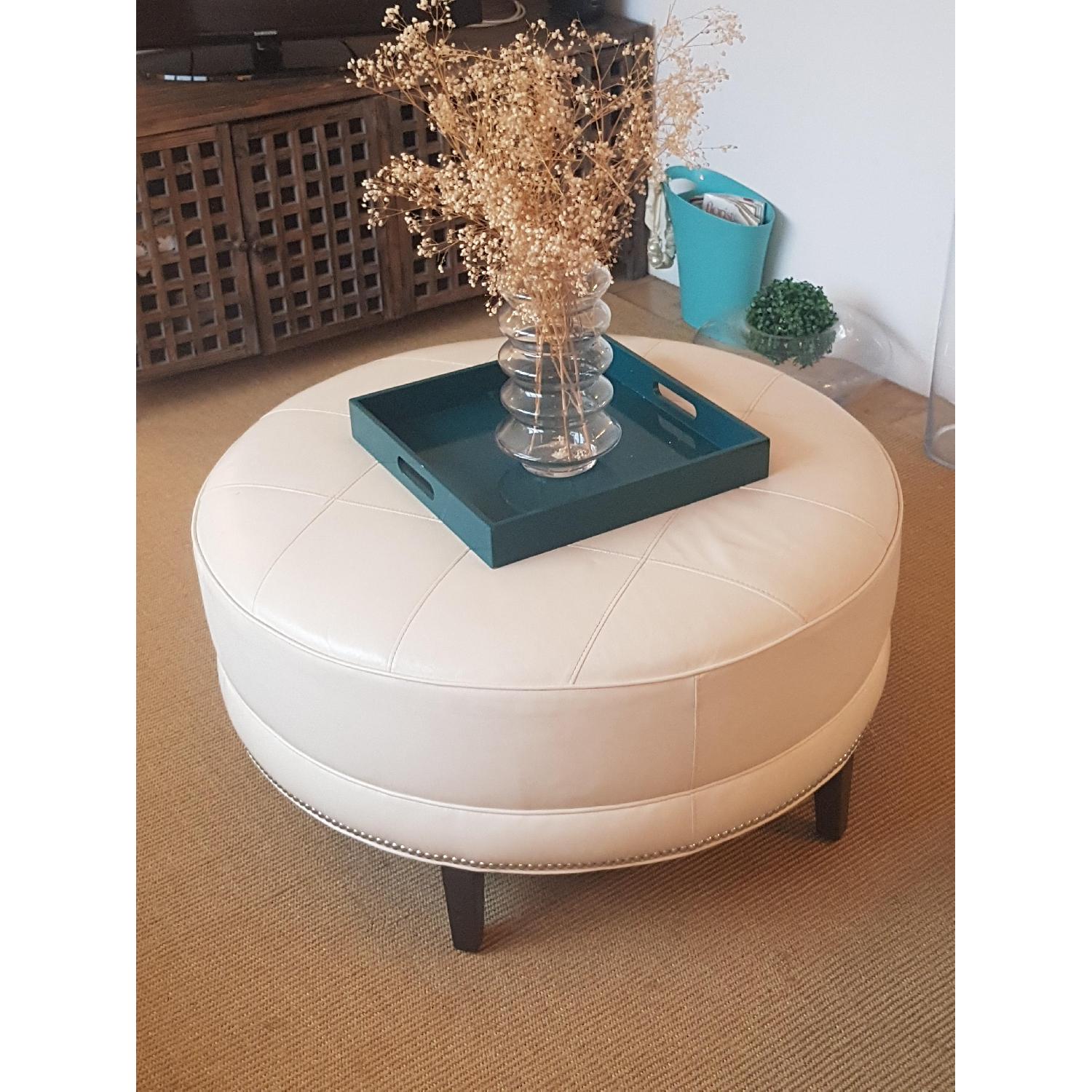 Ethan Allen Modern Round Ottoman in Ivory Leather - image-1