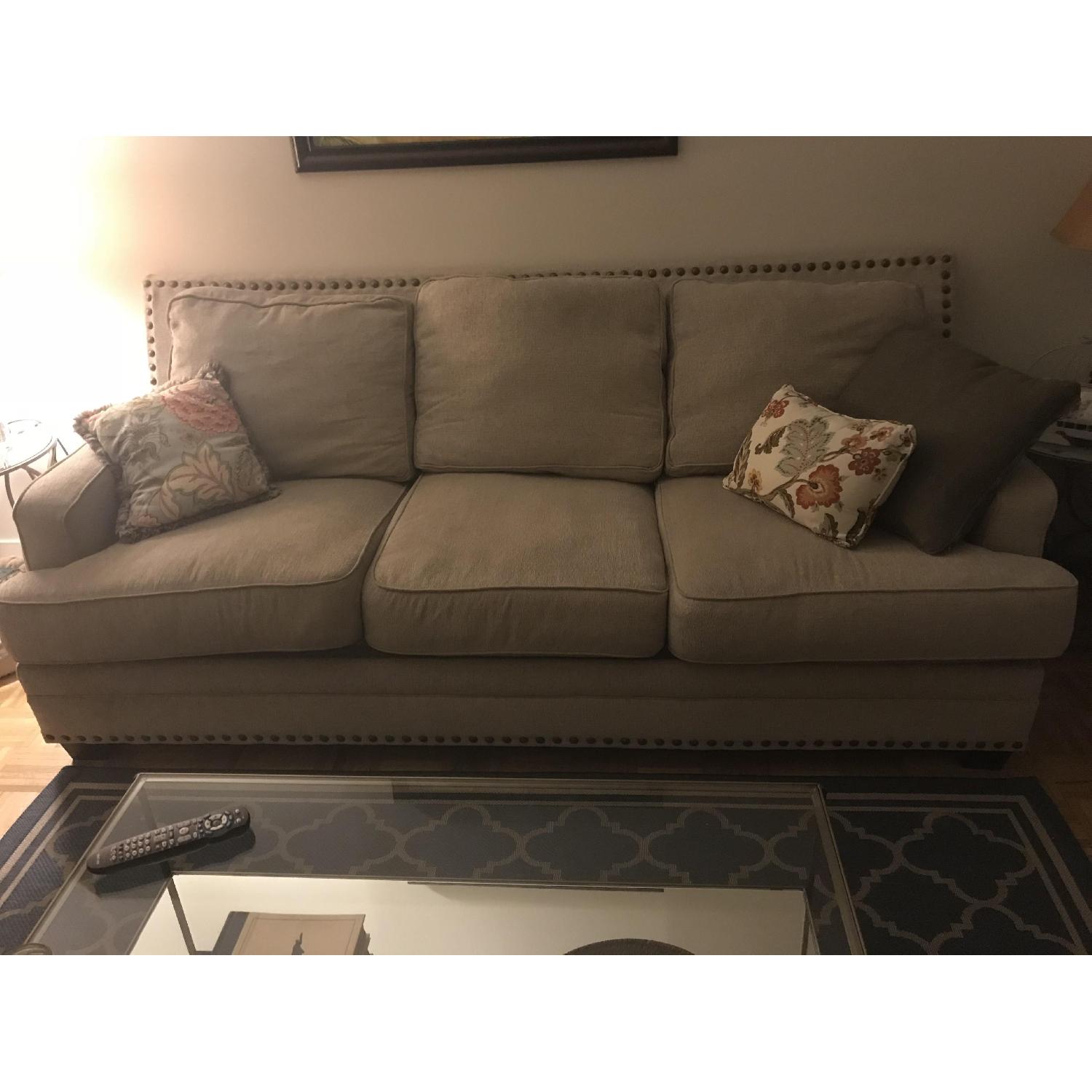 Ashley Beige Fabric Sofa w/ Nailhead Trim AptDeco