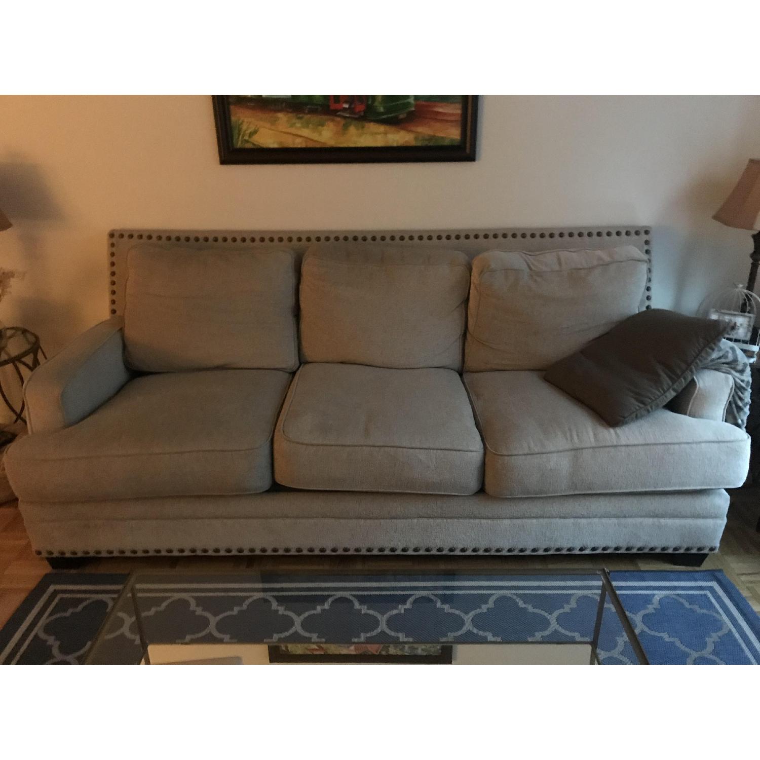 Ashley Beige Fabric Sofa w/ Nailhead Trim - image-2