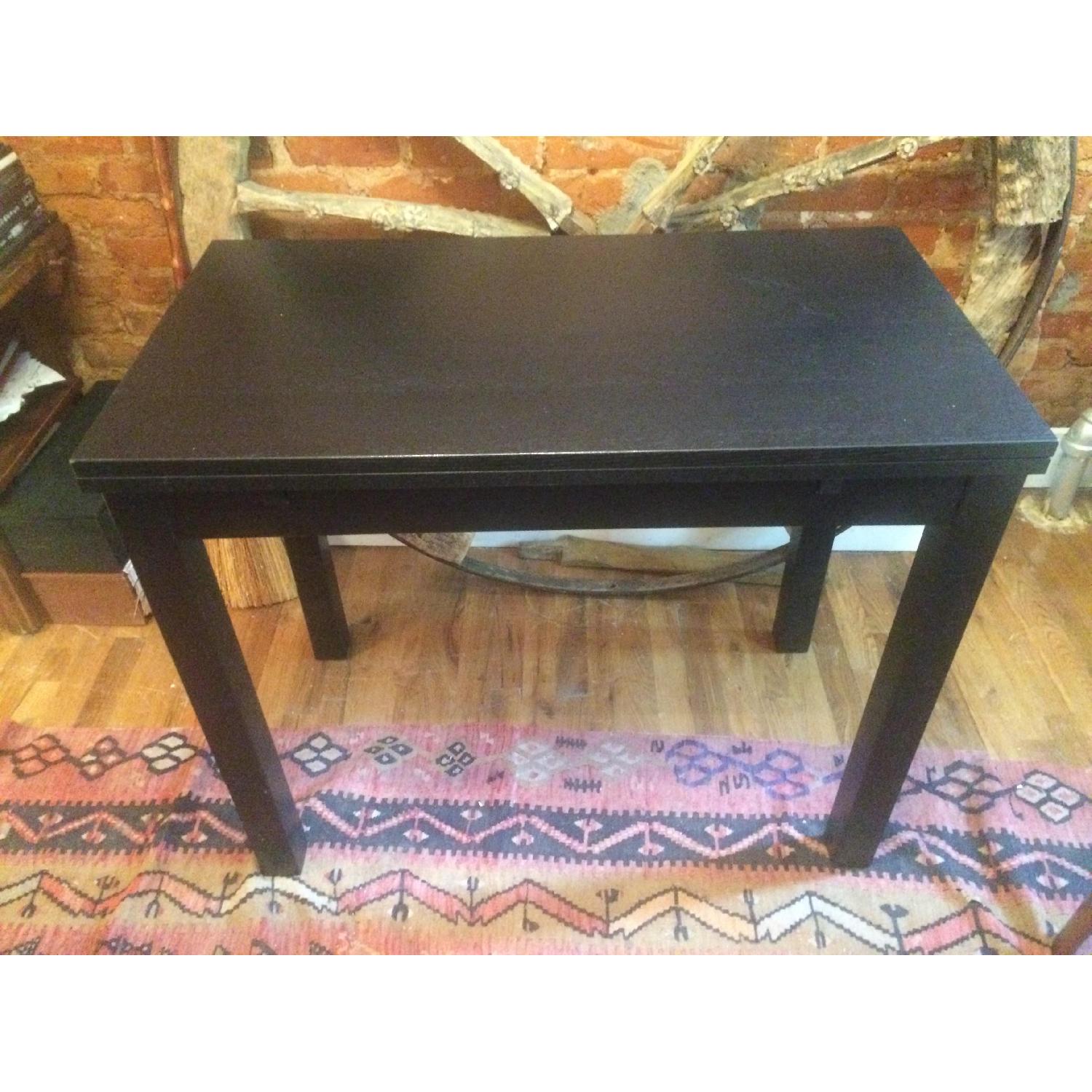 IKEA BJURSTA ビュースター ダイニングテーブル ダークブラウン Ikea Bjursta Black-Brown Extendable Dining Table - AptDeco
