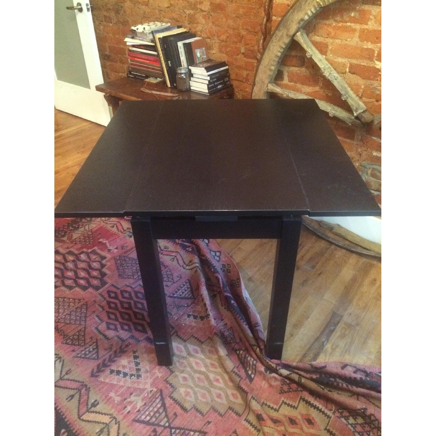 IKEA BJURSTA ビュースター ダイニングテーブル ダークブラウン Ikea Bjursta Black-Brown Extendable Dining Table - AptDeco
