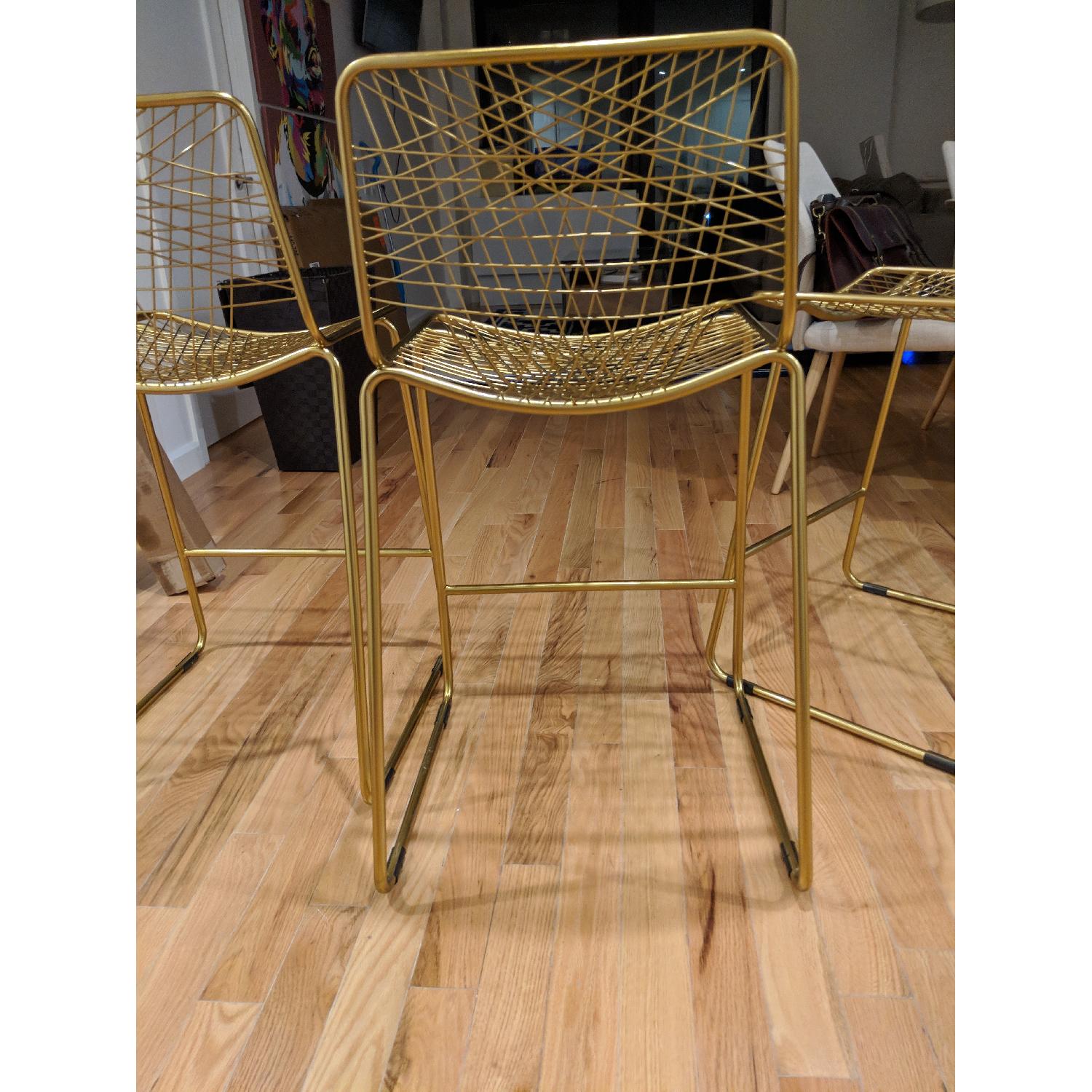 CB2 Alpha Brass Bar Stool AptDeco