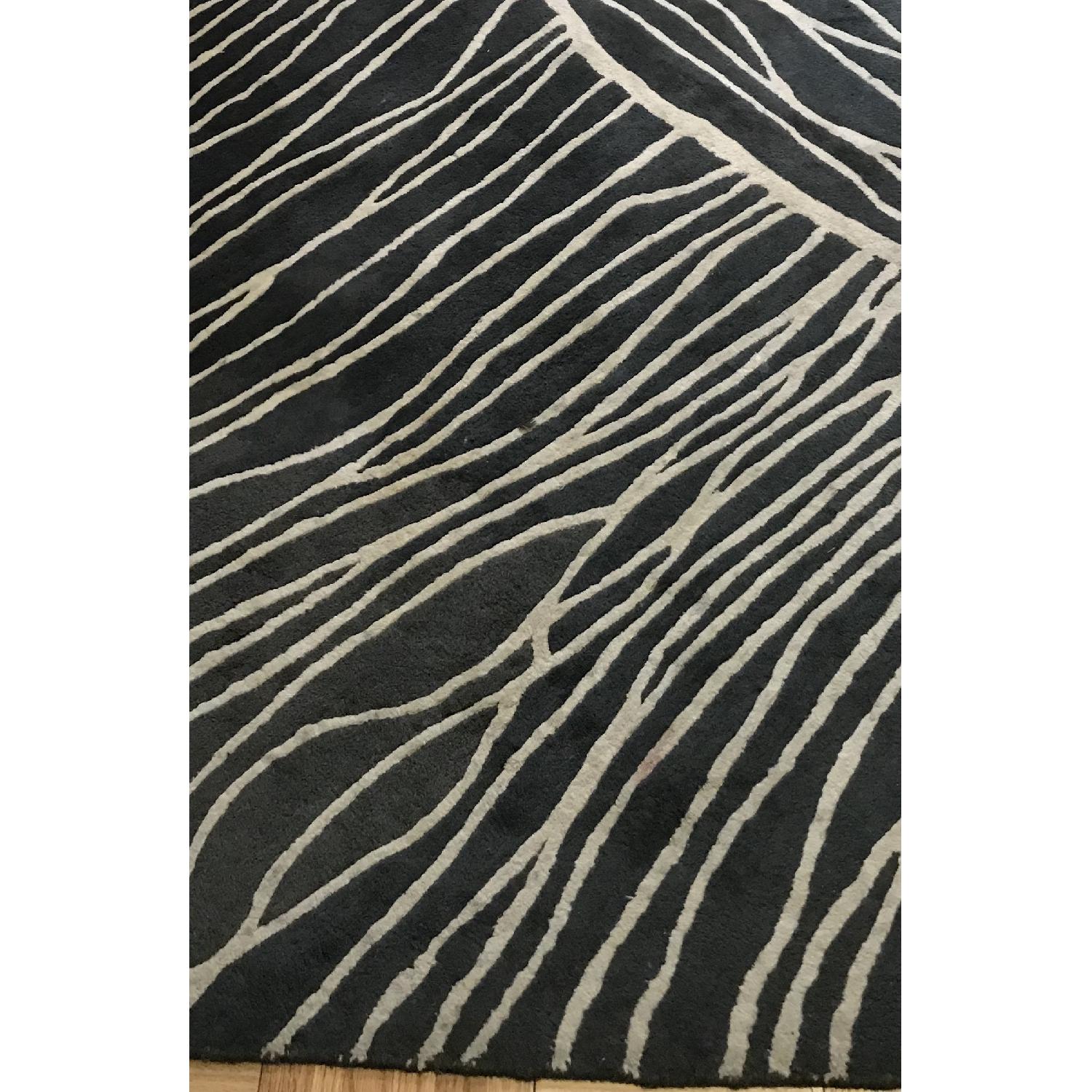CB2 Zebra Inspired Area Rug AptDeco