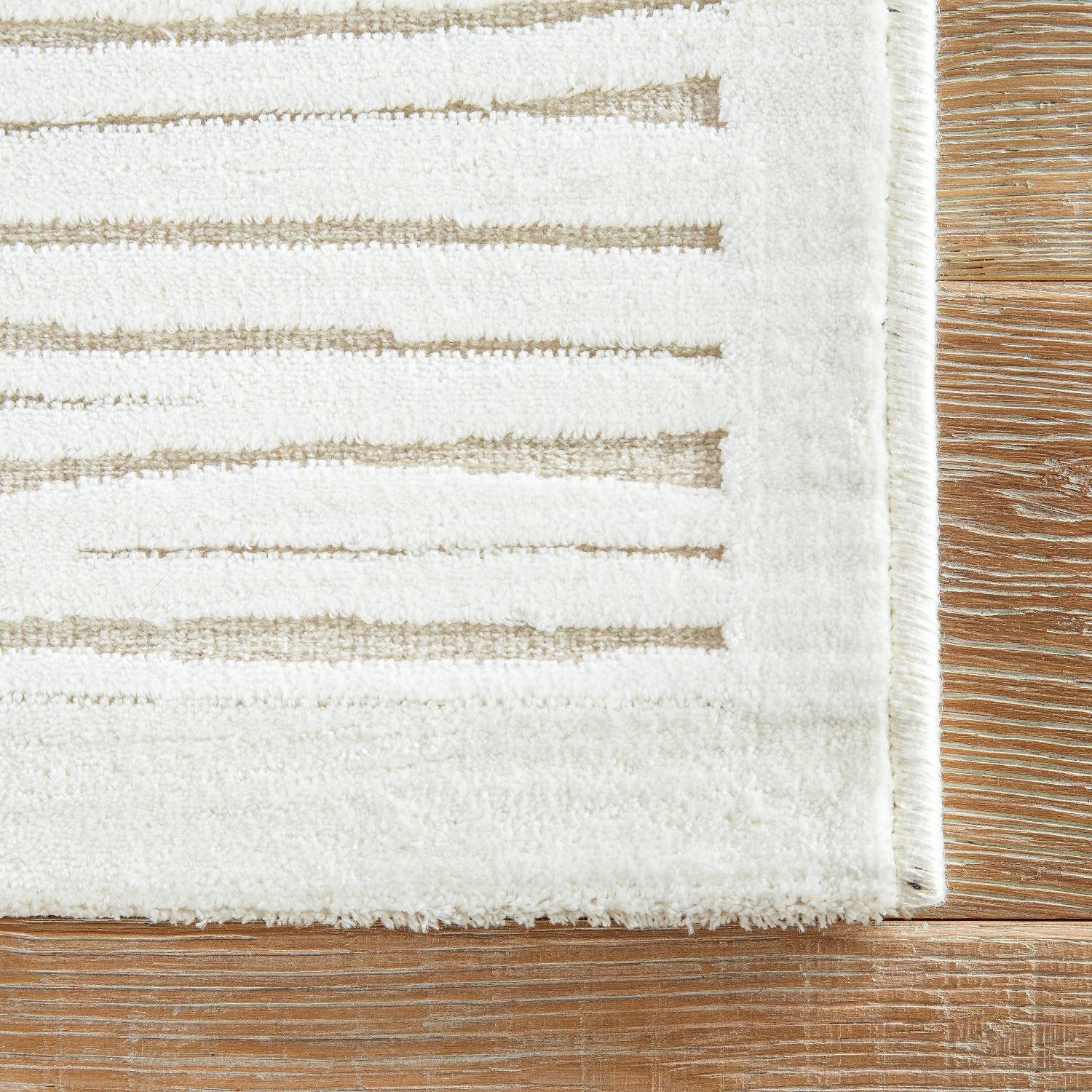 Raya Abstract White Area Rug AptDeco