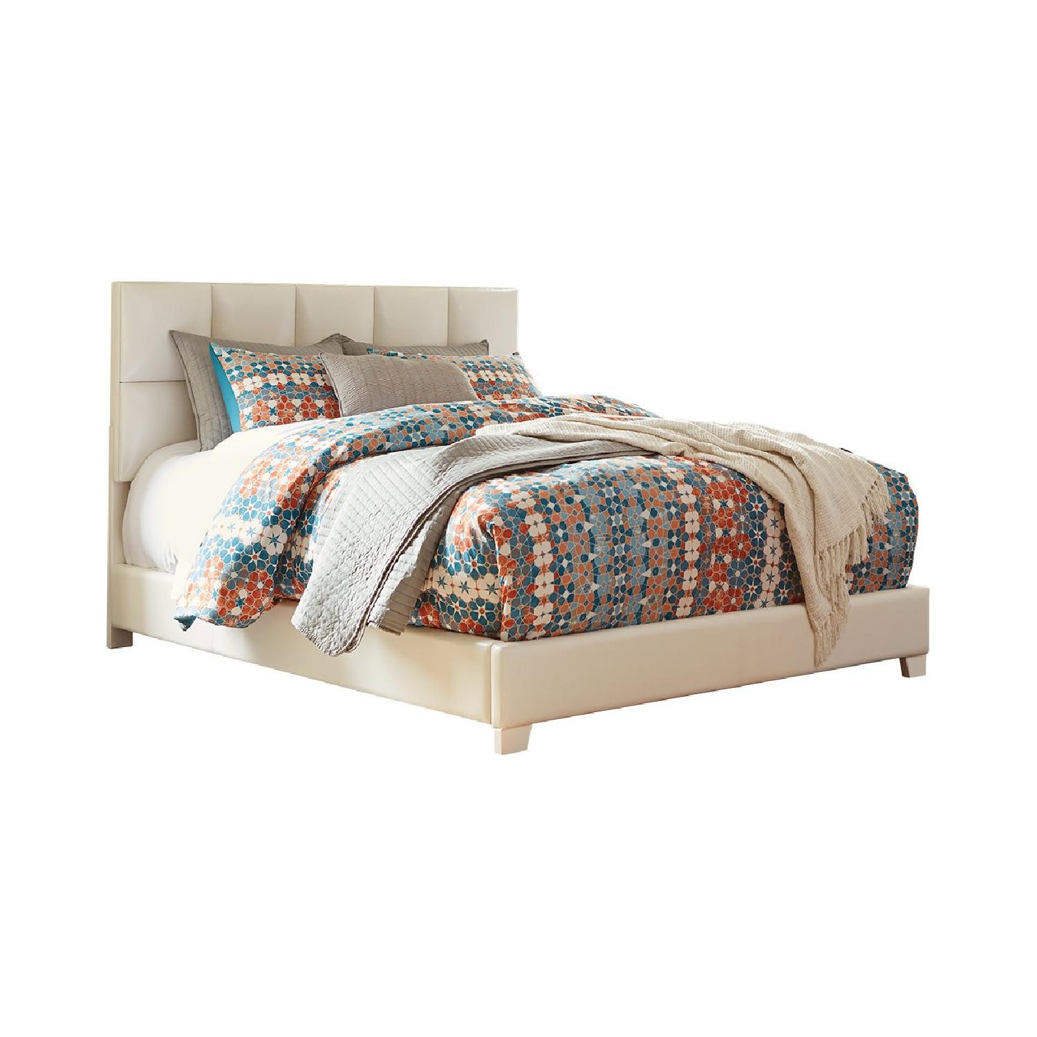 Ashley Upholstered Queen Panel Bed - image-0
