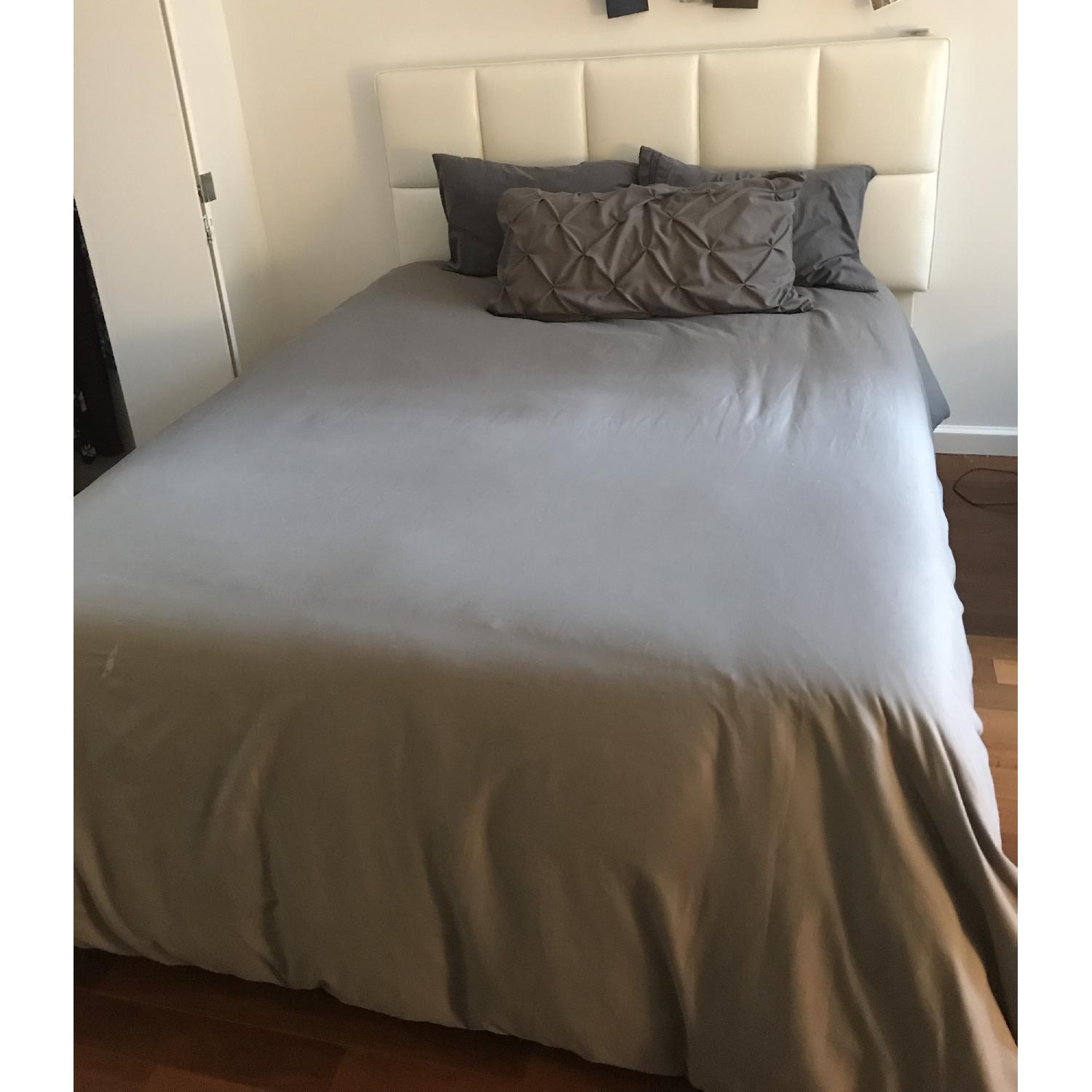 Ashley Upholstered Queen Panel Bed - image-1
