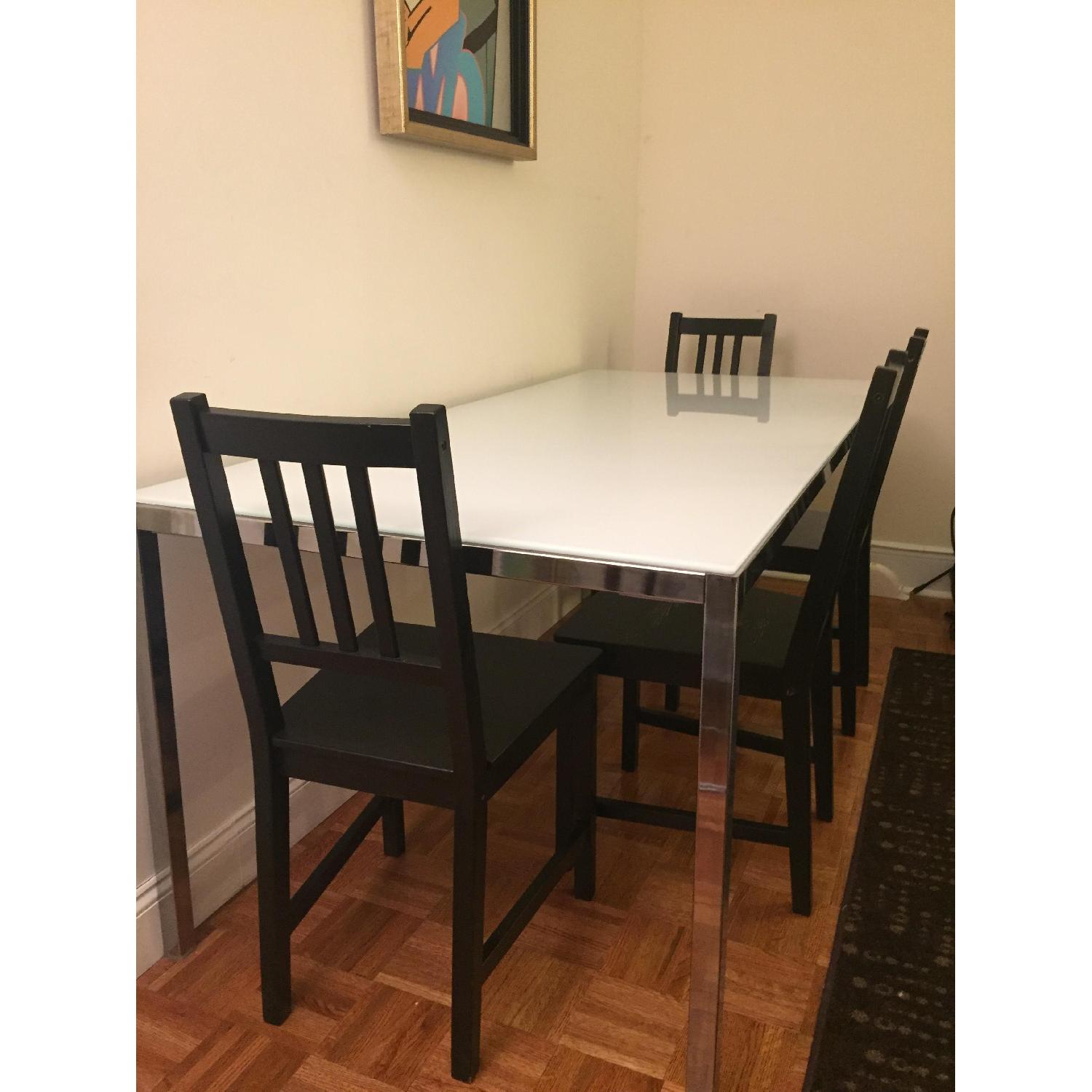 Ikea Glass Top/Steel Frame Dining Table w/ 4 Wood Chairs AptDeco