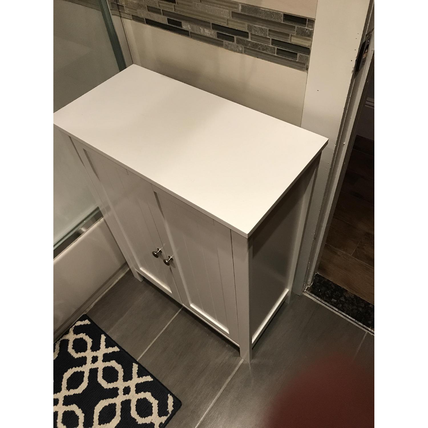 White Shelving Unit w/ Doors AptDeco