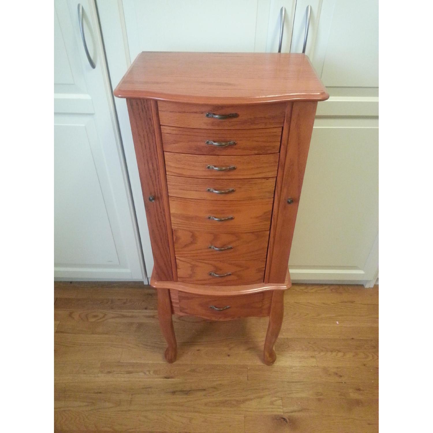 JC Penney Furniture Oak/Cherry Wood Finish Jewelry Armoire - image-1