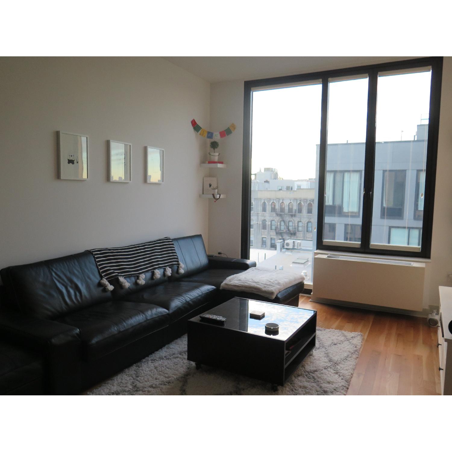 Ikea Black Leather 2Piece Chaise Sectional Sofa & Ottoman AptDeco