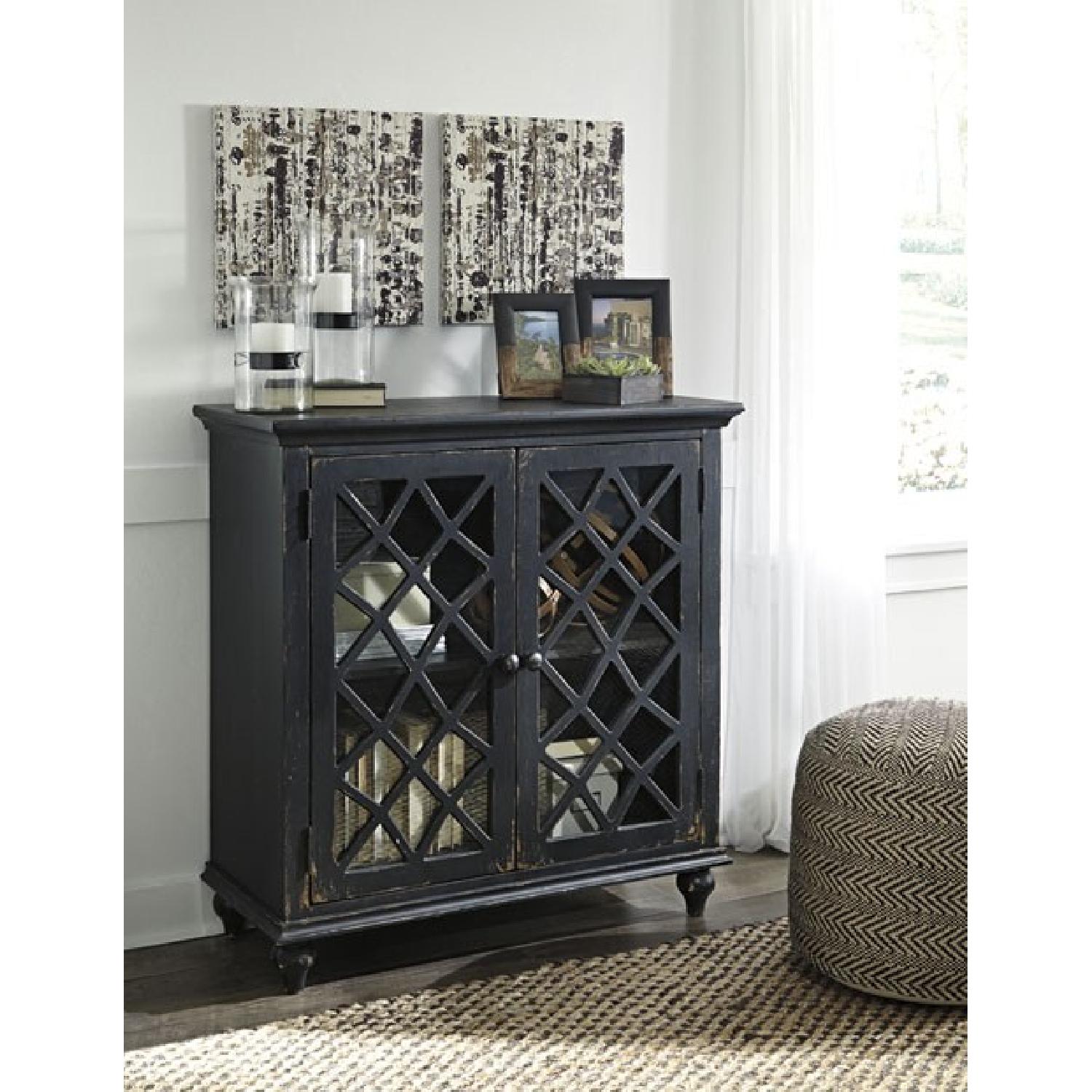 Ashley's Mirimyn Antique Black Accent w/ Glass Inlay Doors