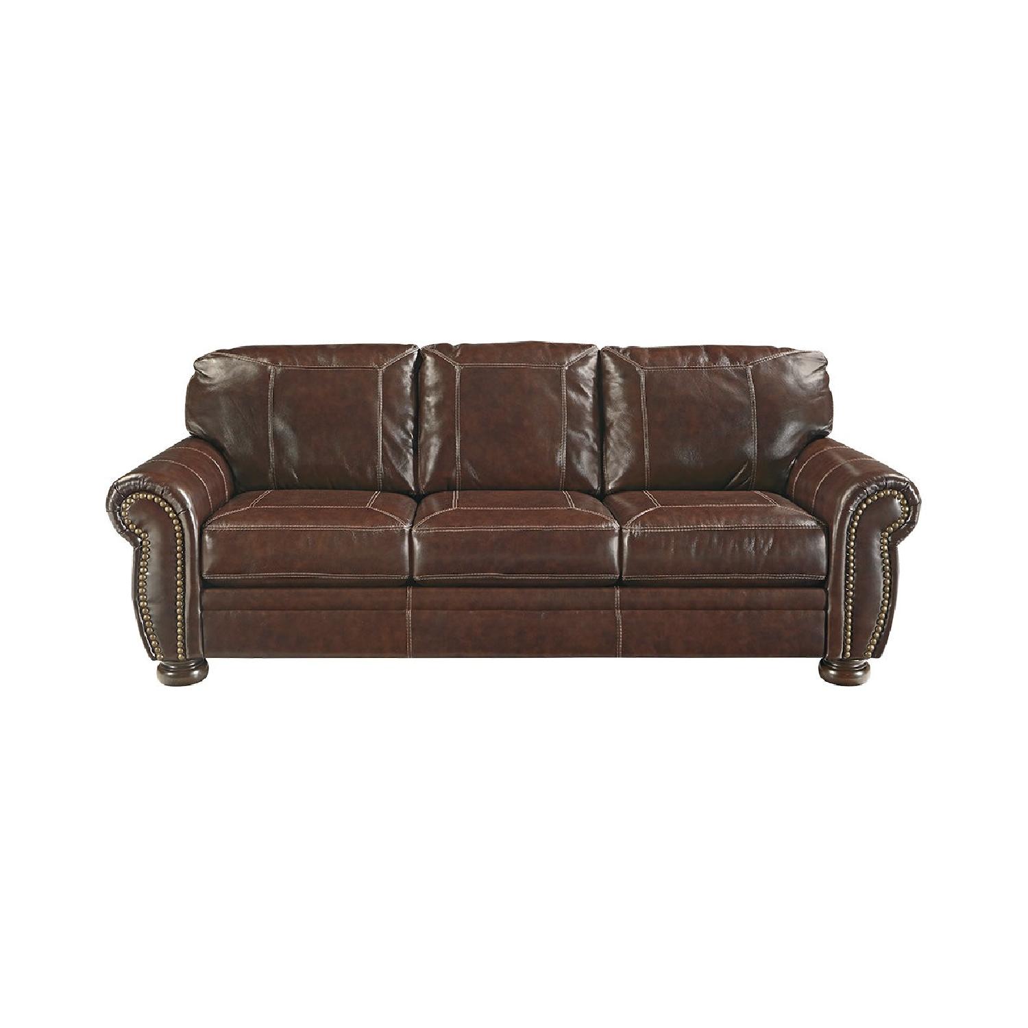 Ashley Banner Brown Leather Sofa - image-0