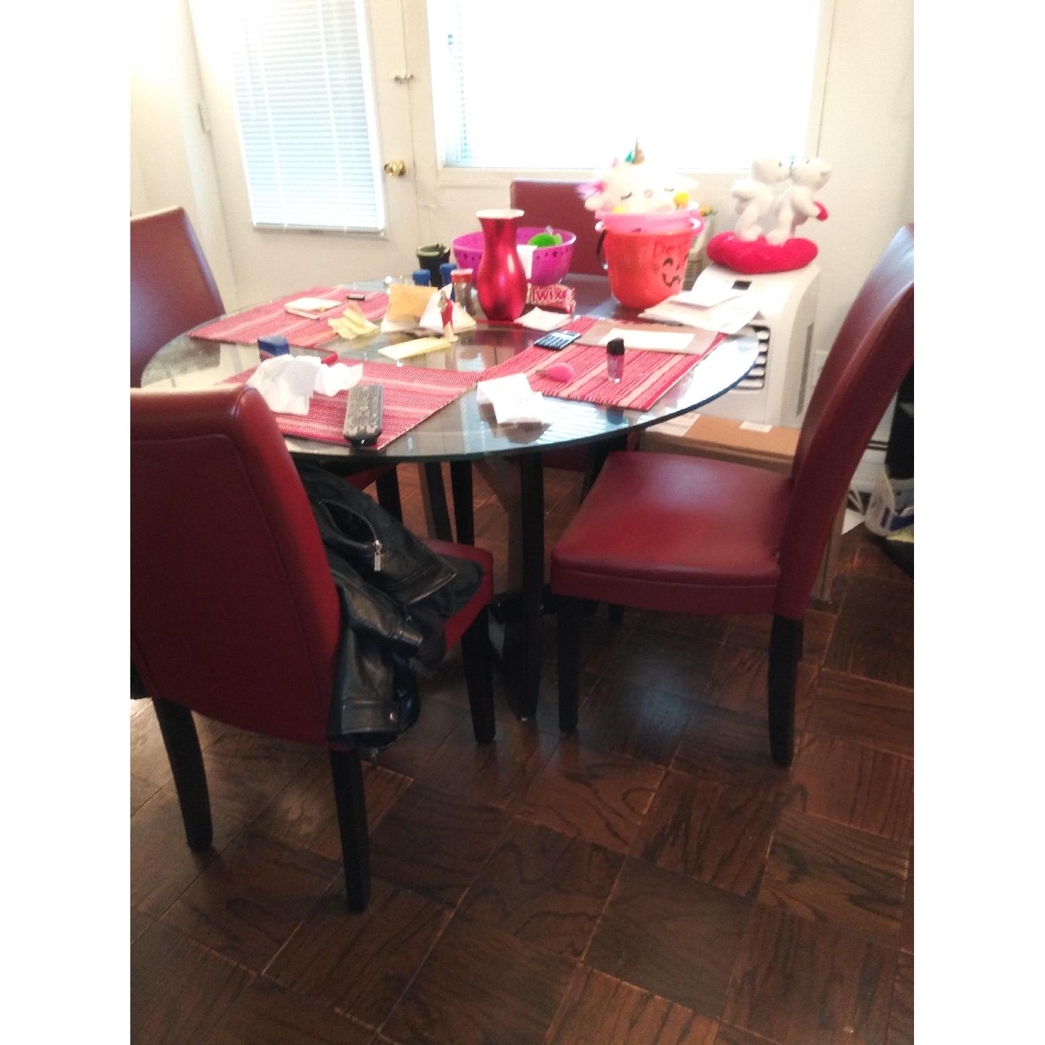 Bob's Glass Dining Table w/ 4 Red Leather Chairs AptDeco