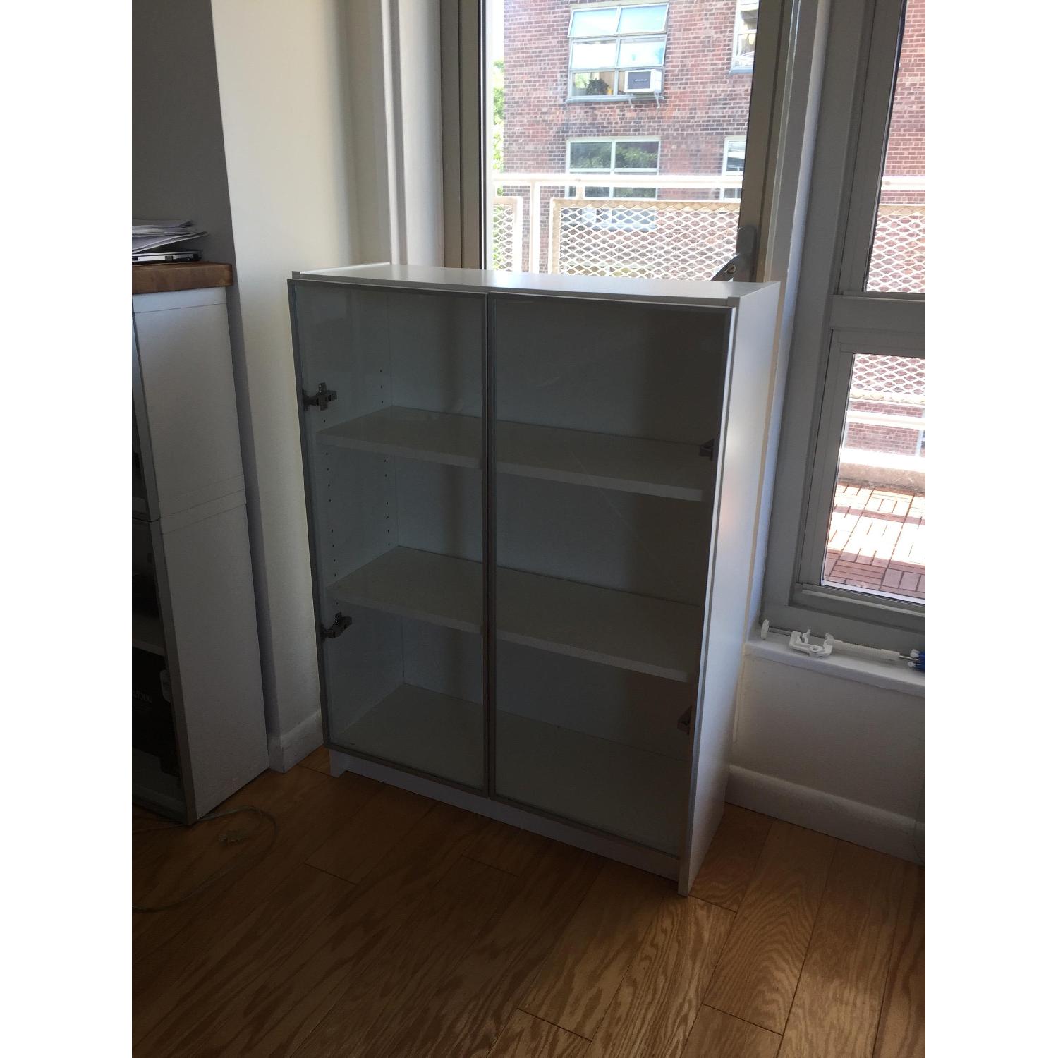 Ikea White Wooden Bookcase w/ Glass Doors - image-1