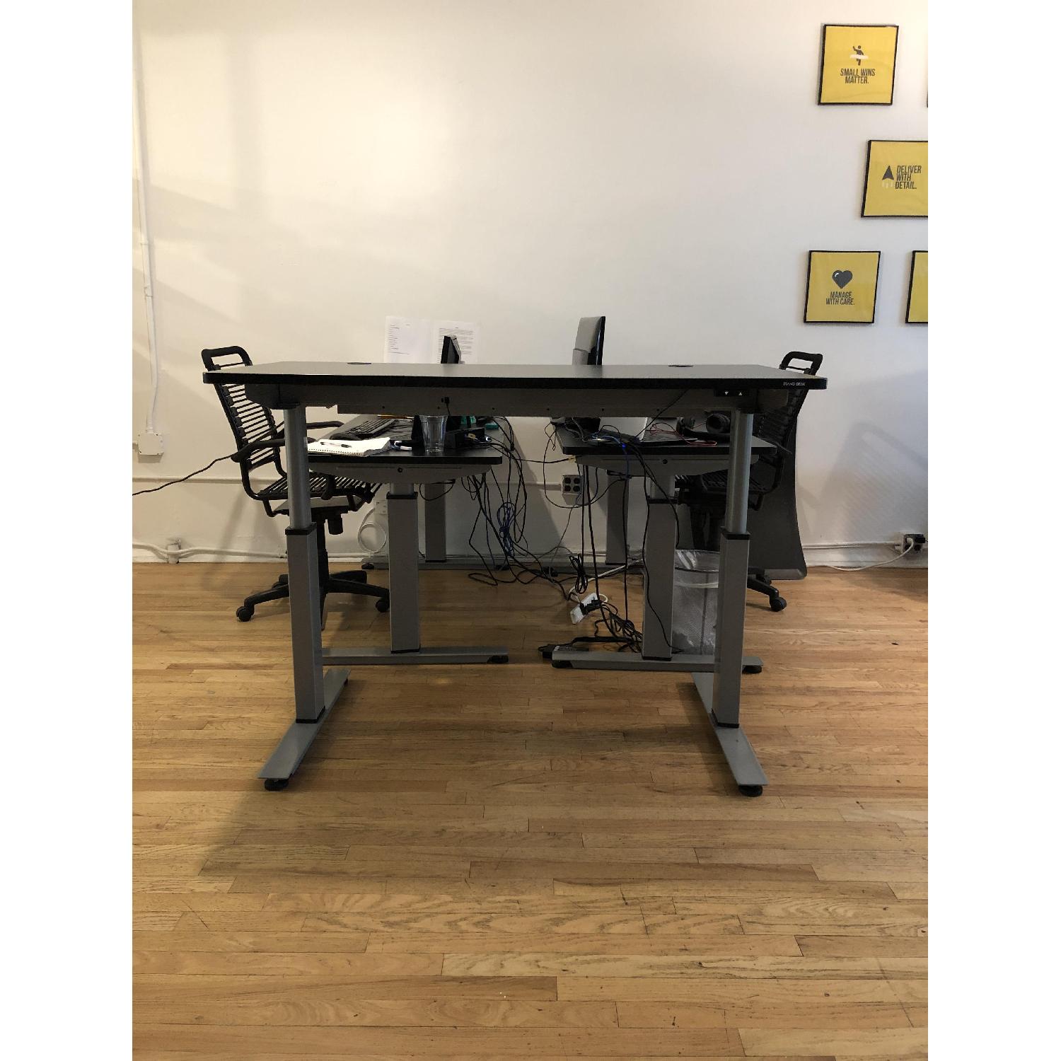 StandDesk Sit/Stand Motorized Desk w/ Built-In Power Plugs - image-1