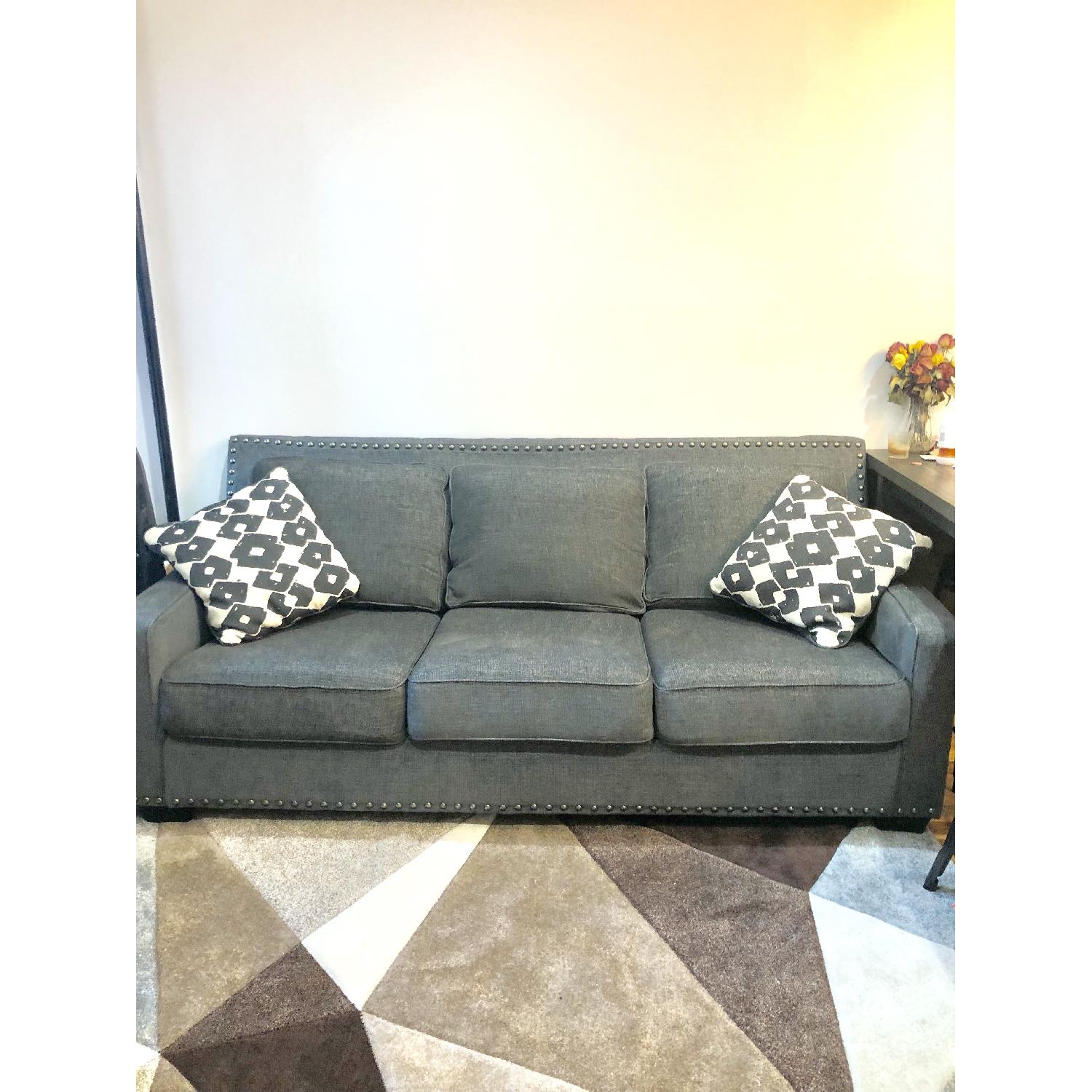 Ashley Brace Sofa & Ottoman - image-2