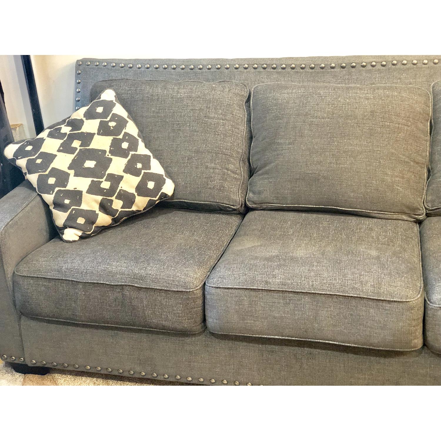 Ashley Brace Sofa & Ottoman - image-3