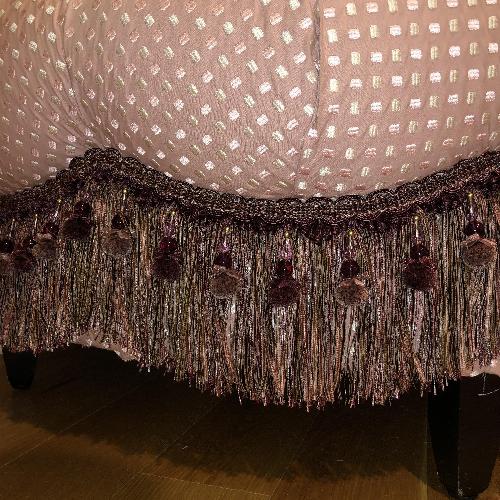 Used Custom Tufted Round Ottoman w/ Tassel Trim for sale on AptDeco
