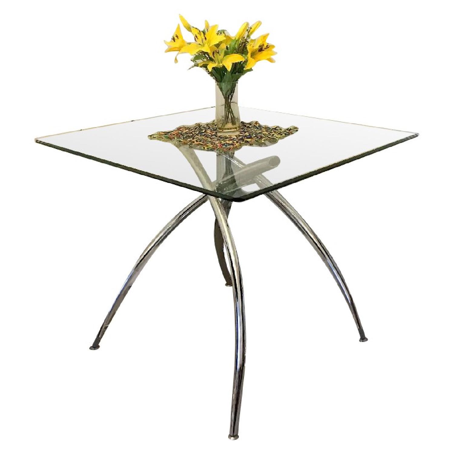 Raymour & Flanigan Glass & Chrome Dining Table AptDeco