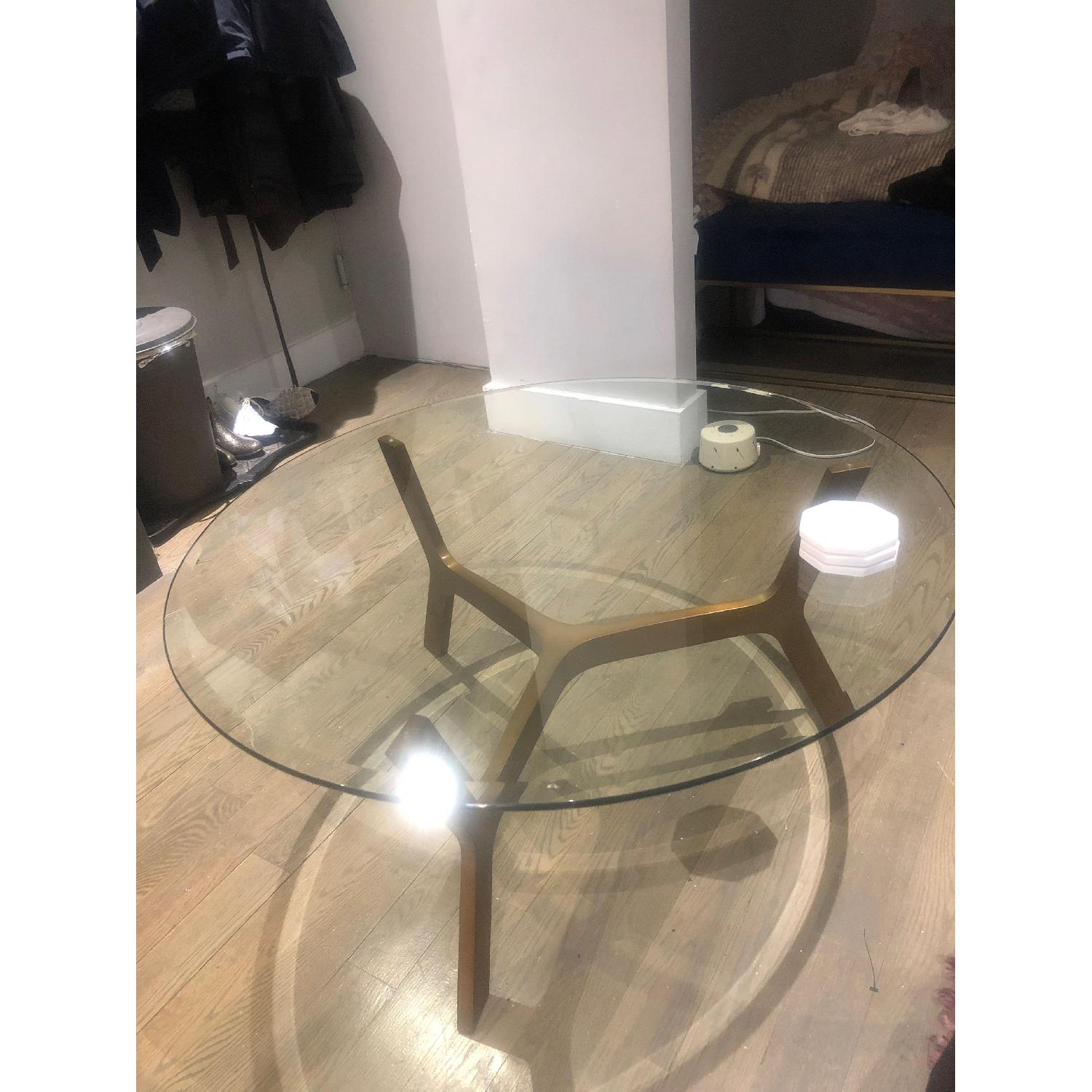 Crate & Barrel Elke Round Glass Coffee Table AptDeco