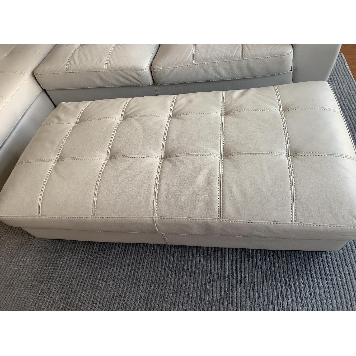 Rooms To Go Off White Faux Leather Sectional Sofa & Ottoman - image-4