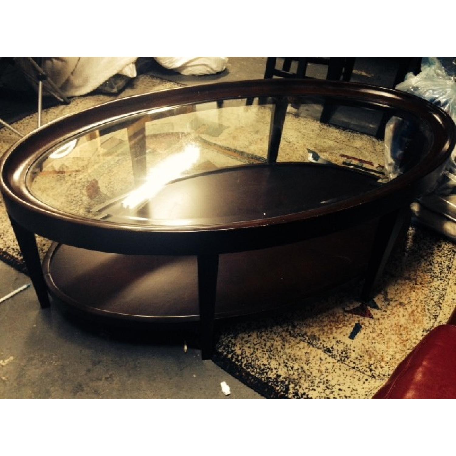 Raymour & Flanigan Mahogany Oval Coffee Table AptDeco