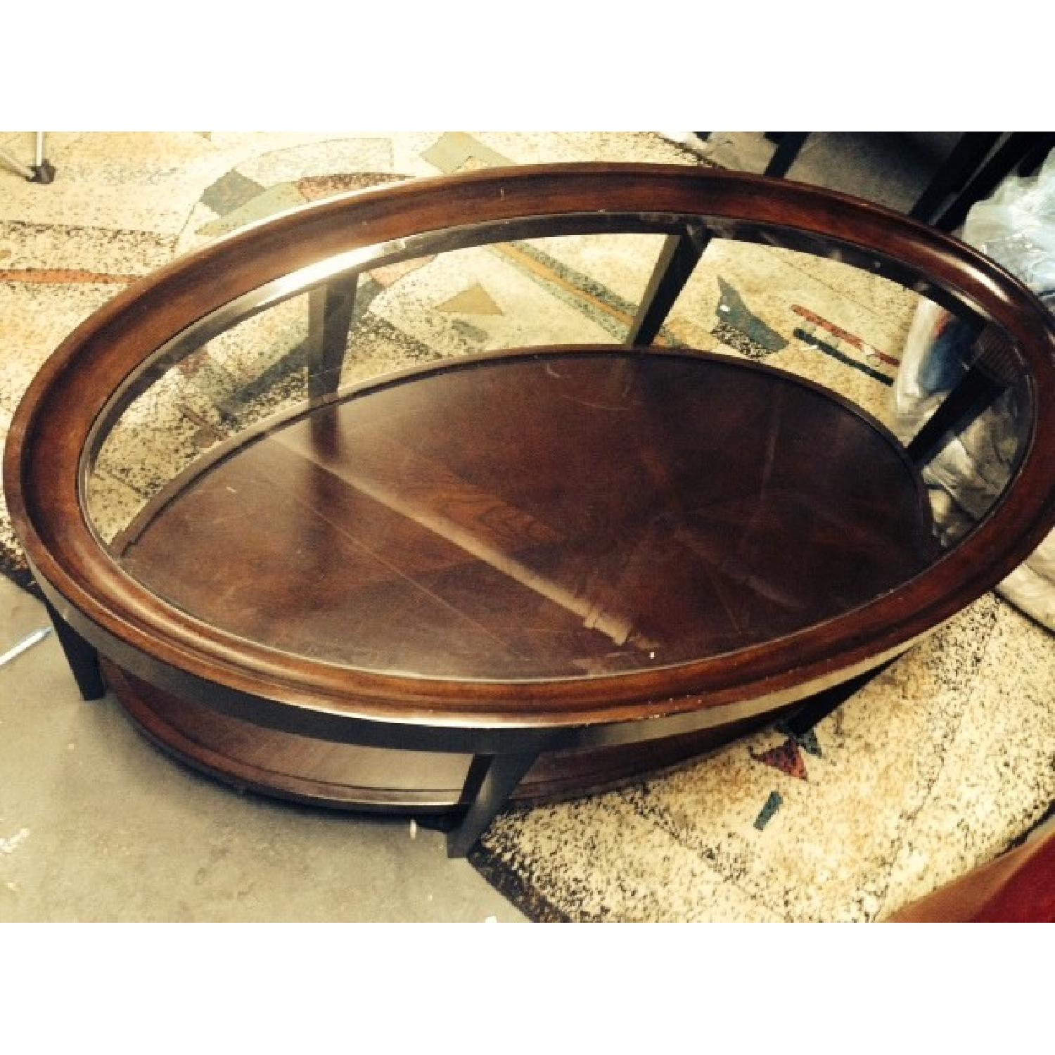 Raymour & Flanigan Mahogany Oval Coffee Table AptDeco