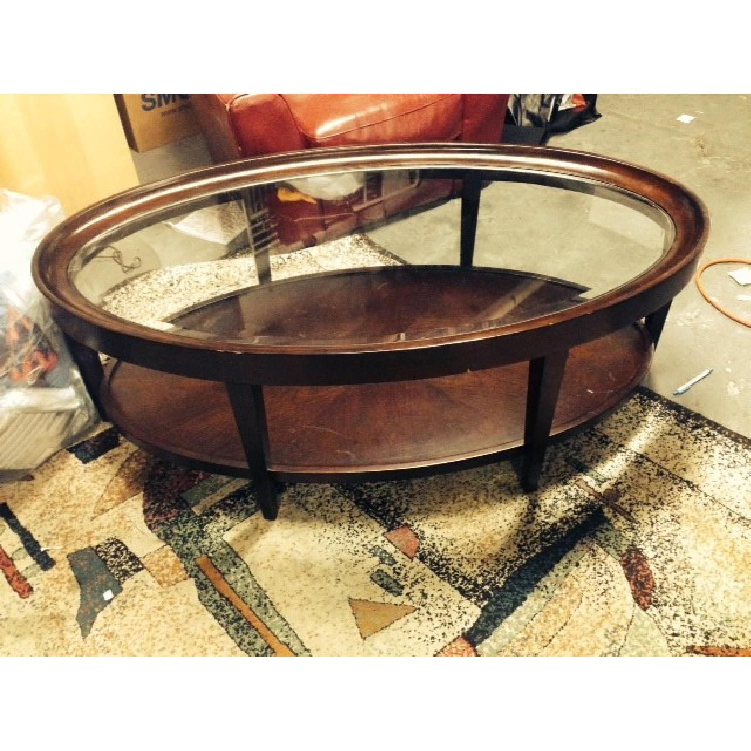 Raymour & Flanigan Mahogany Oval Coffee Table AptDeco